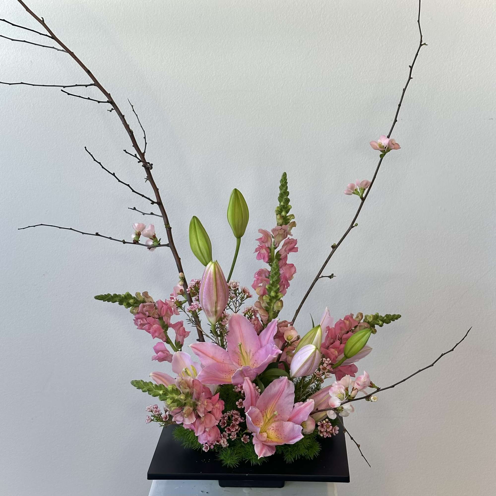 Discover the serene elegance of our Spring Blossom Ikebana-style arrangement, a harmonious
