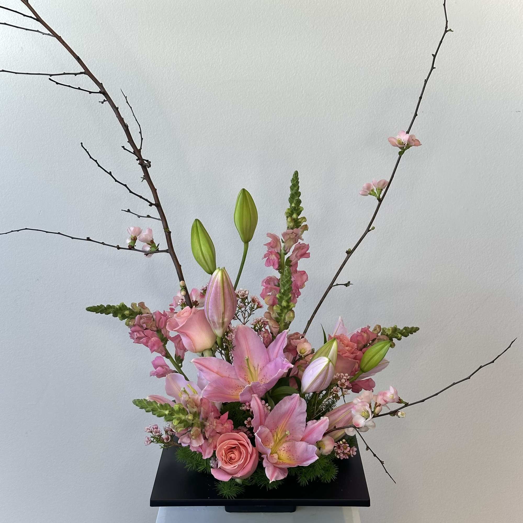 Discover the serene elegance of our Spring Blossom Ikebana-style arrangement, a harmonious