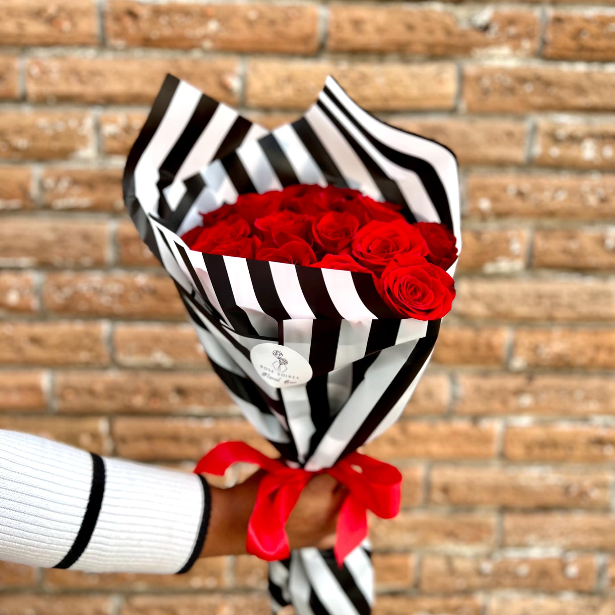 Classic Red Roses with a Rose Soiree touch of opulent black and