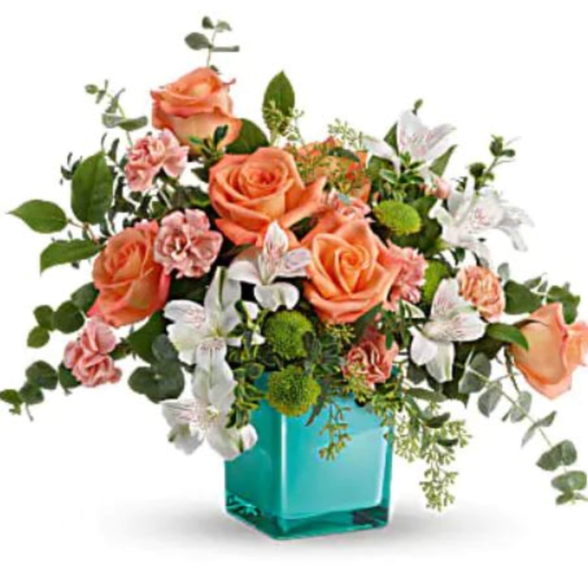 This delightful arrangement features peach roses, white alstroemeria, peach miniature carnations, green