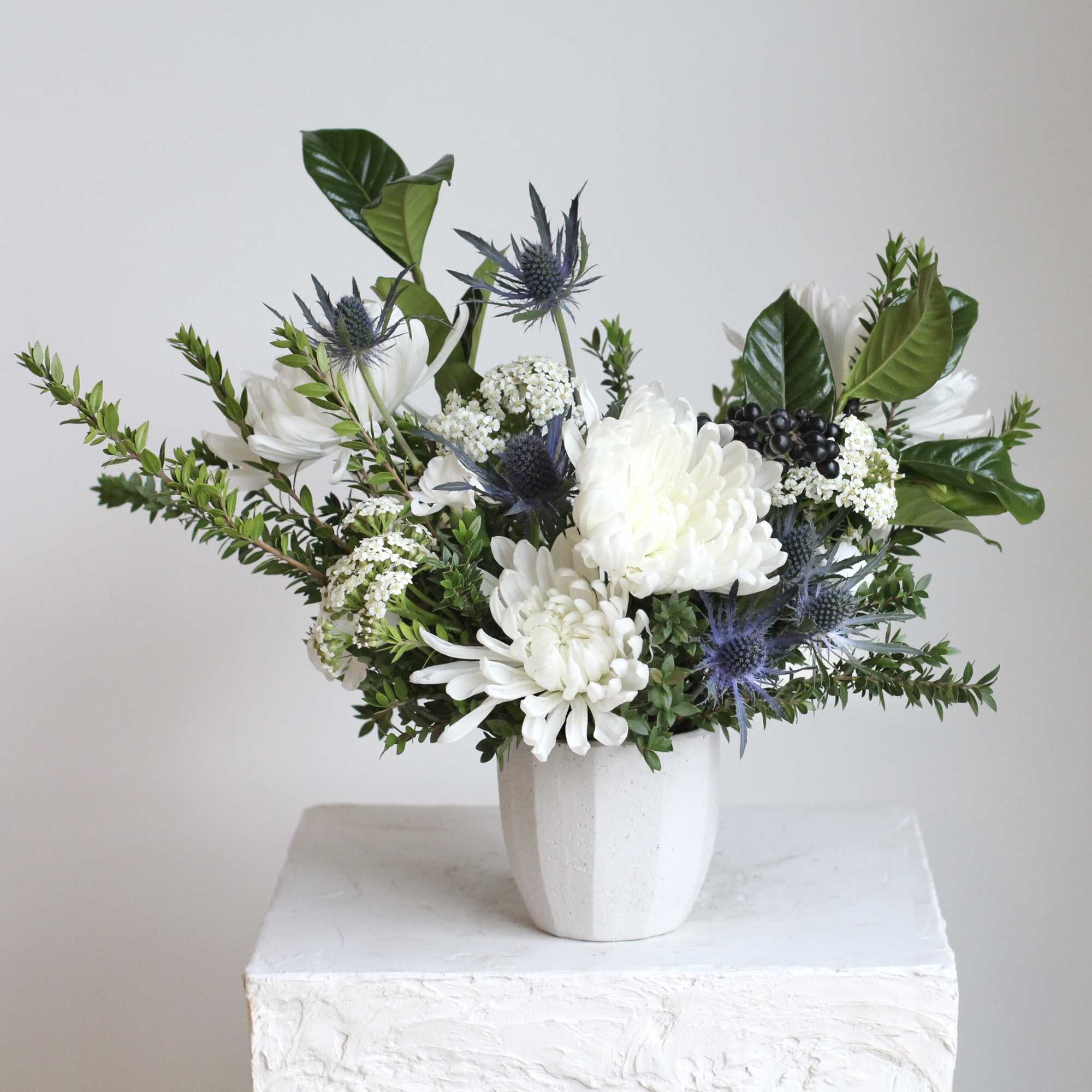 Delicate blue nigella and orlaya add soft, intricate textures, while fresh myrtle