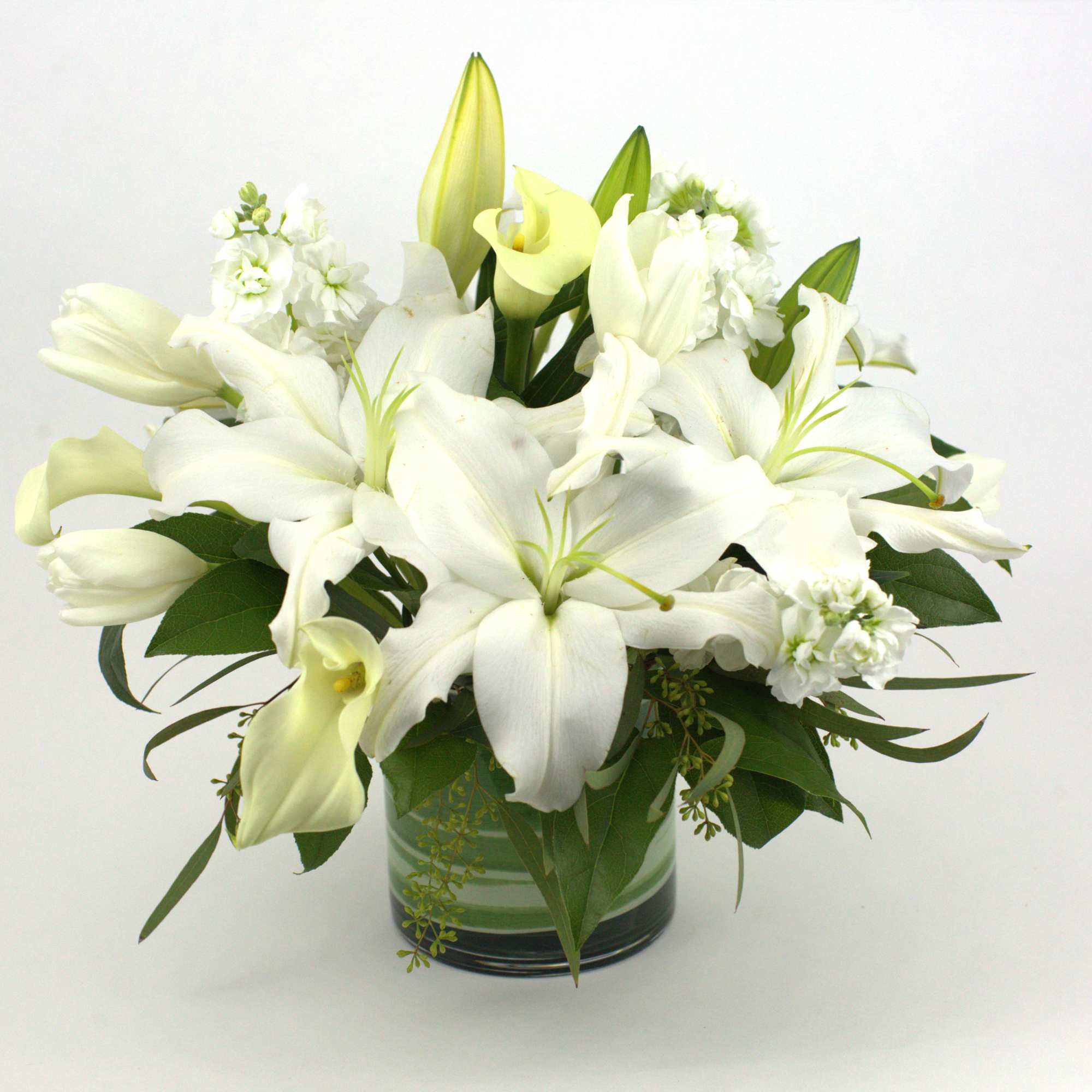 CLASSIC WHITE MIXED FLOWERS WITH LILIES

Classic and fragrant. This all-white flower arrangement