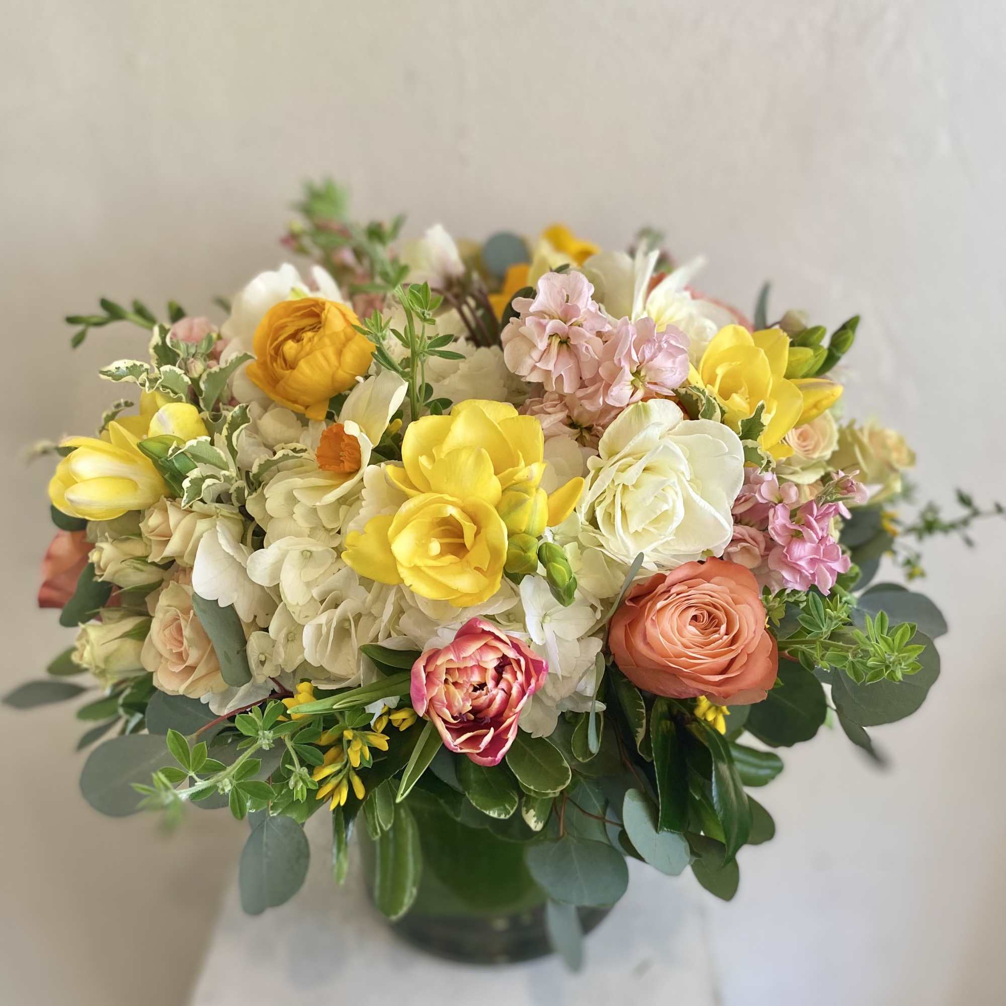 Cheerful mixture of colorful spring-time blooms.