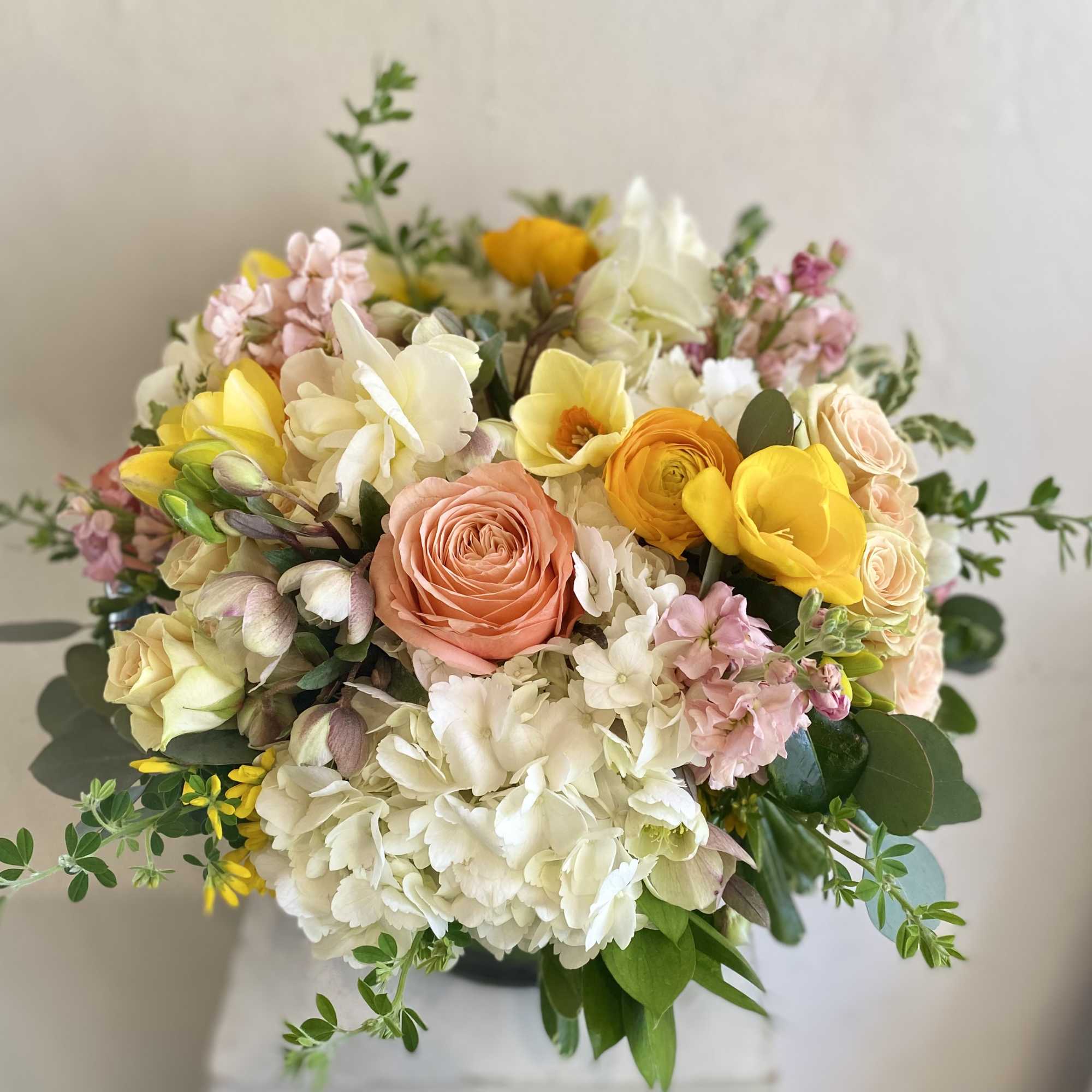 Cheerful mixture of colorful spring-time blooms.