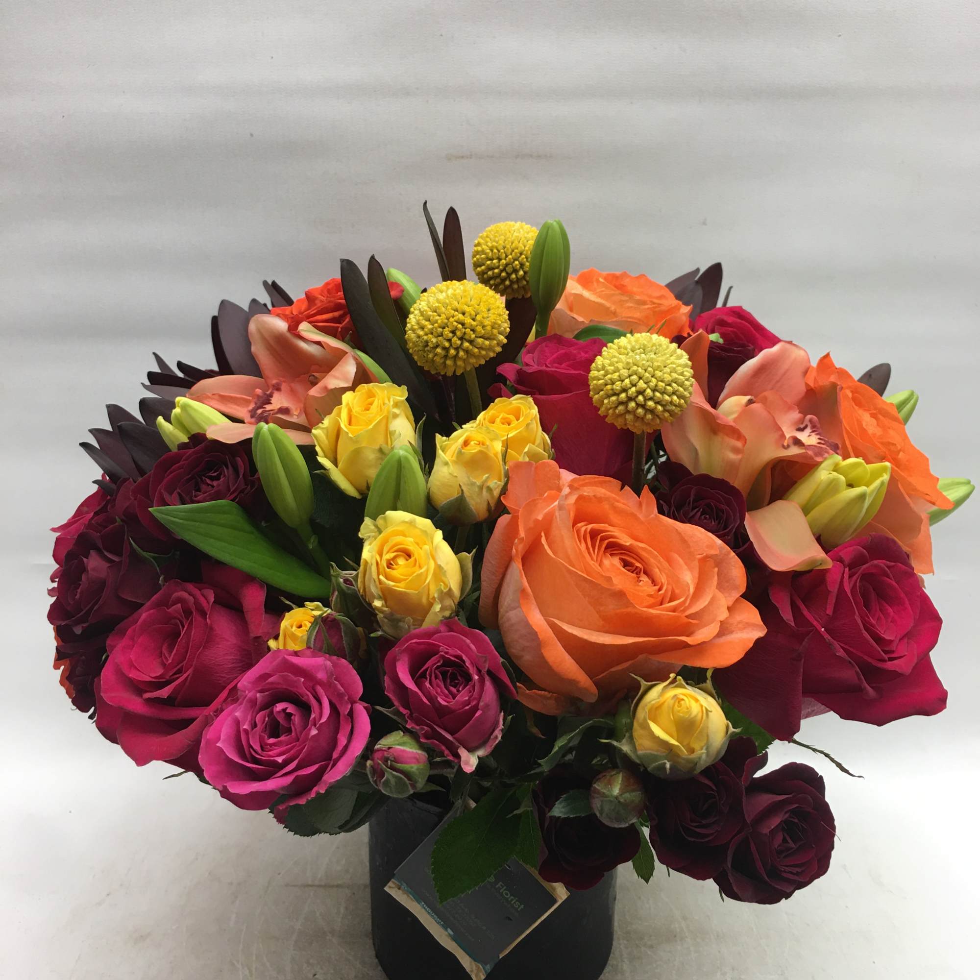 This cylindrical vase of flowers is kind of like a time capsule