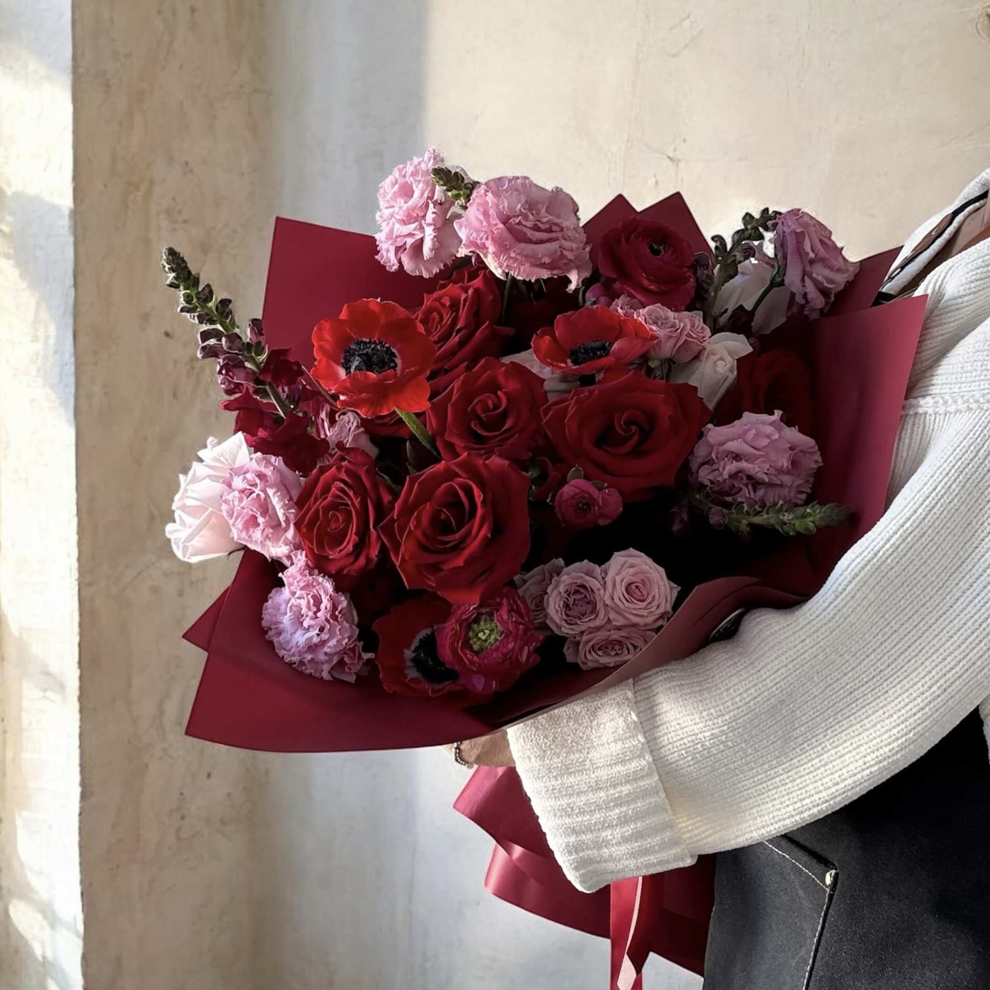  An opulent mix of pinks and deep reds, wrapped to perfection.