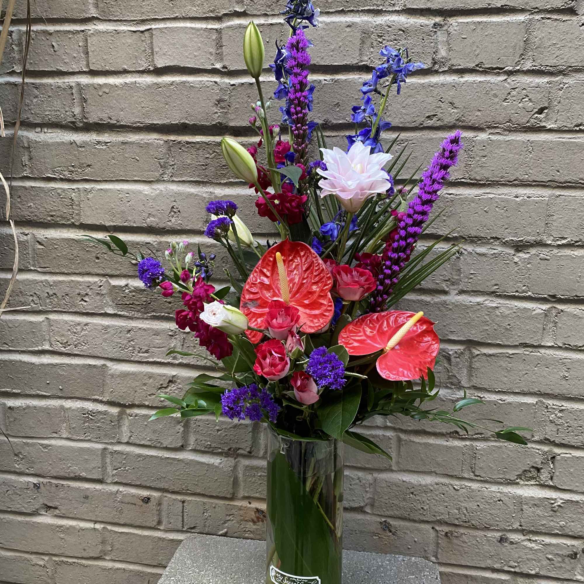 "Touch of Vibrance" is a beautiful and unique floral design that is