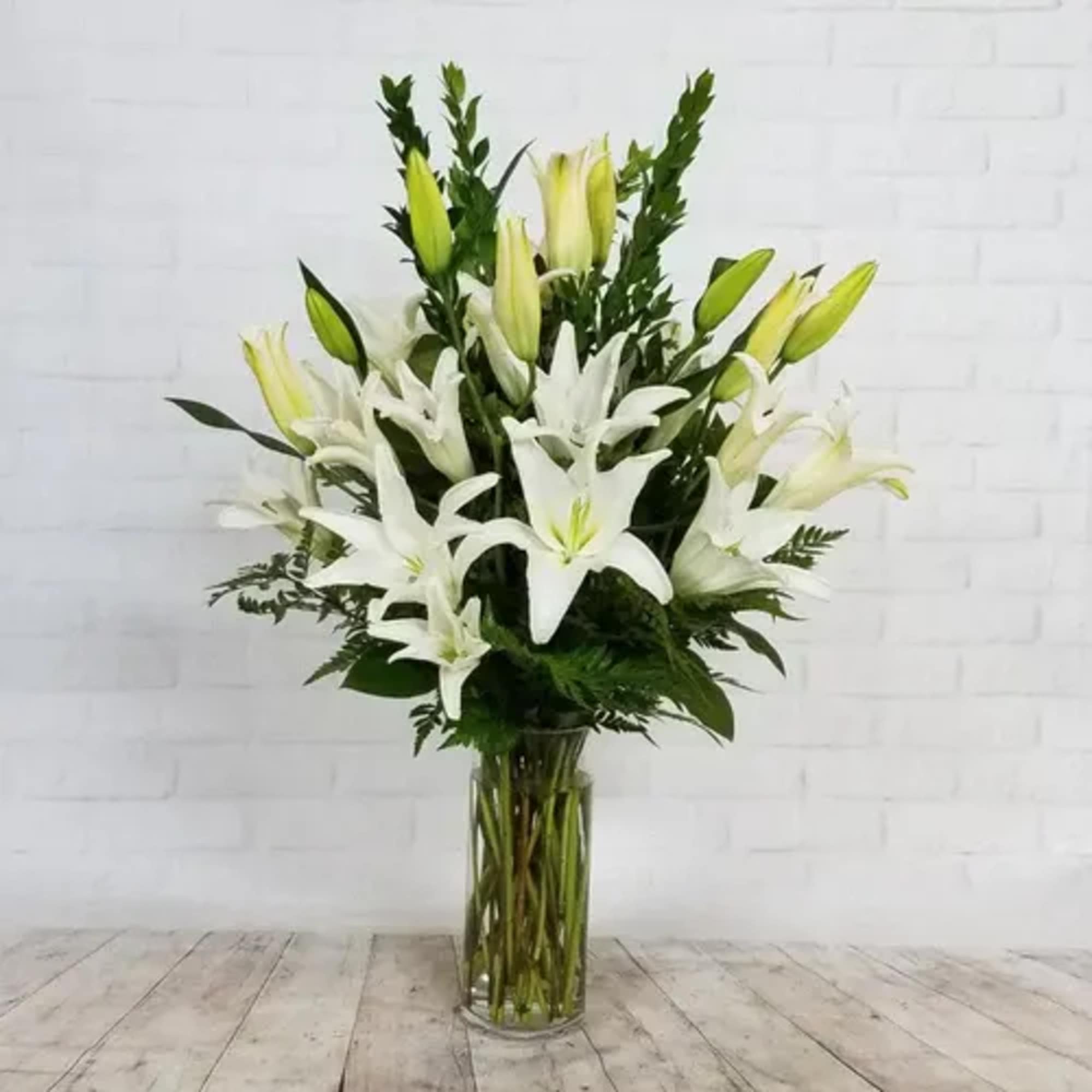 With Loving Thoughts is a serene sympathy arrangement designed to express care