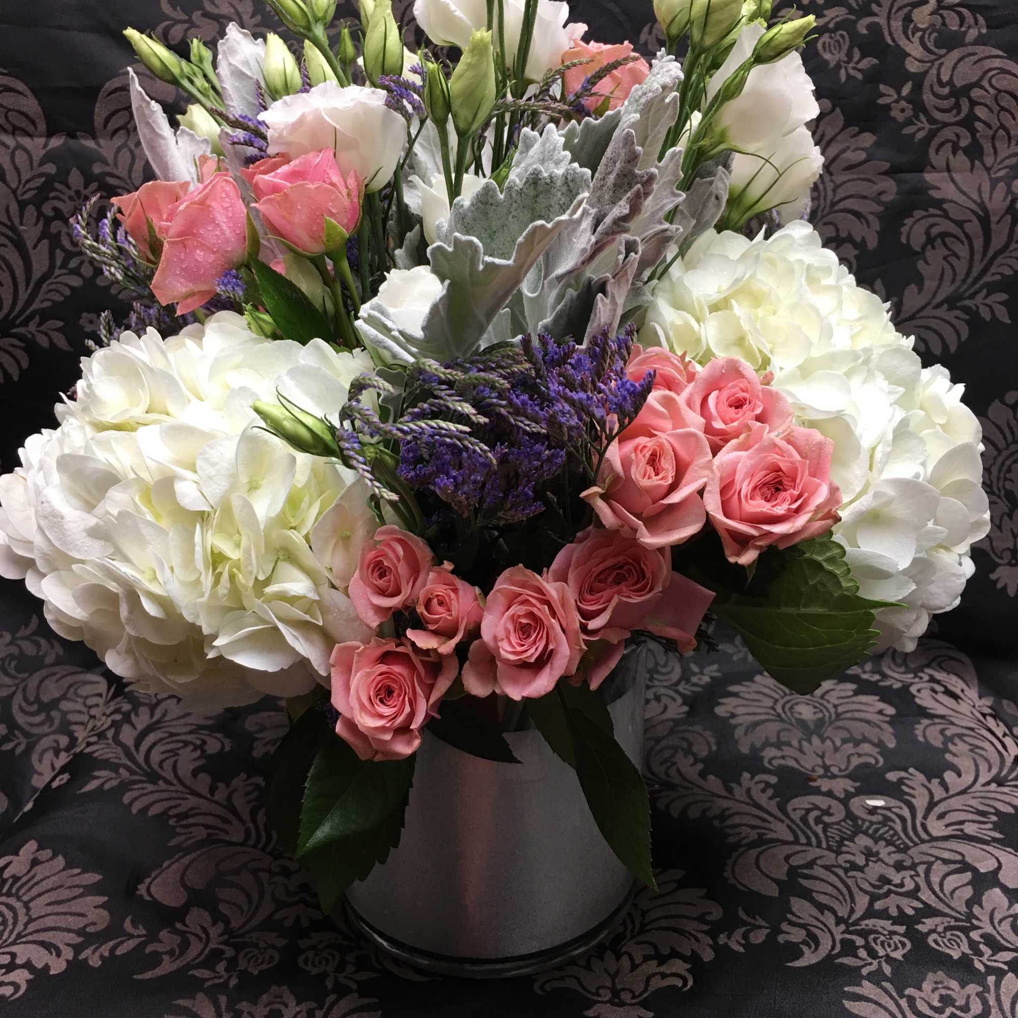 This angelic arrangement is as cute as it is pretty. Featuring the