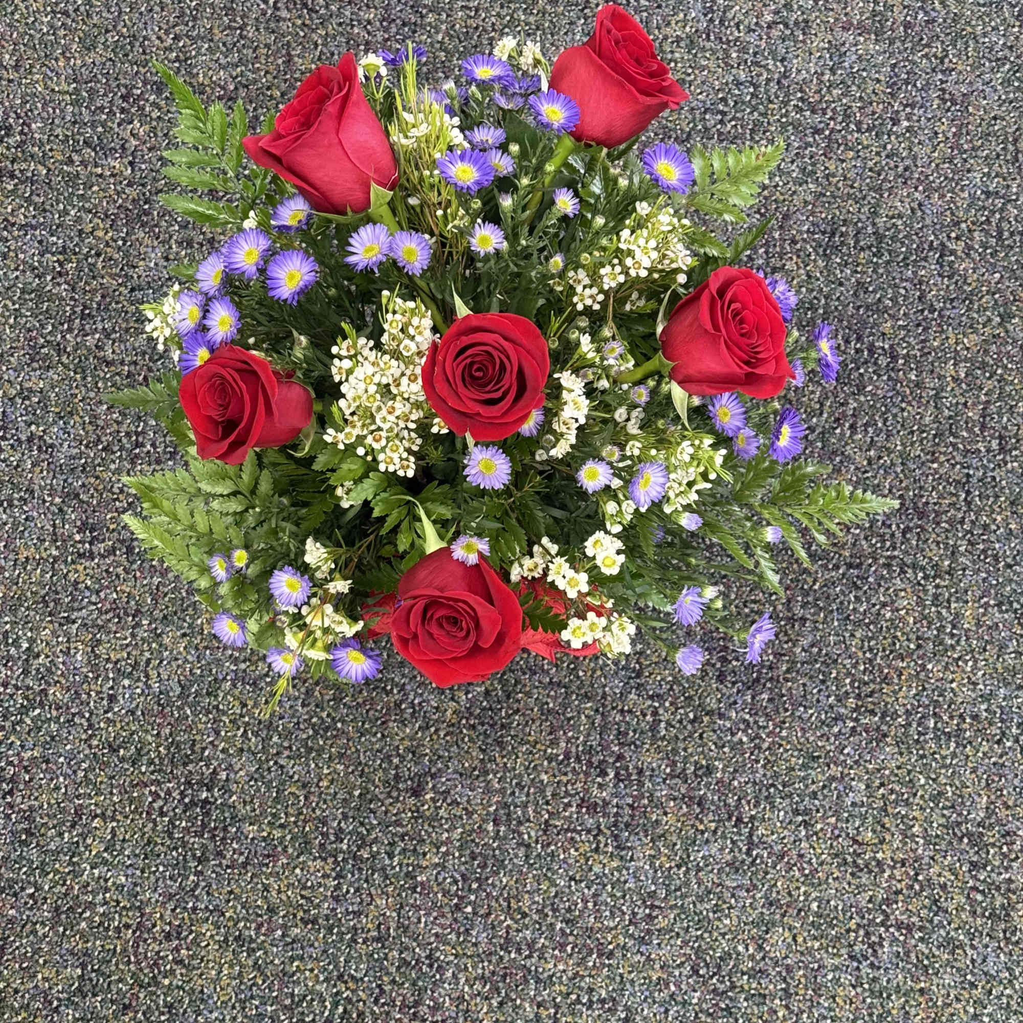 6 Roses in a vase with filler
Please call, for certain color rose

**Some