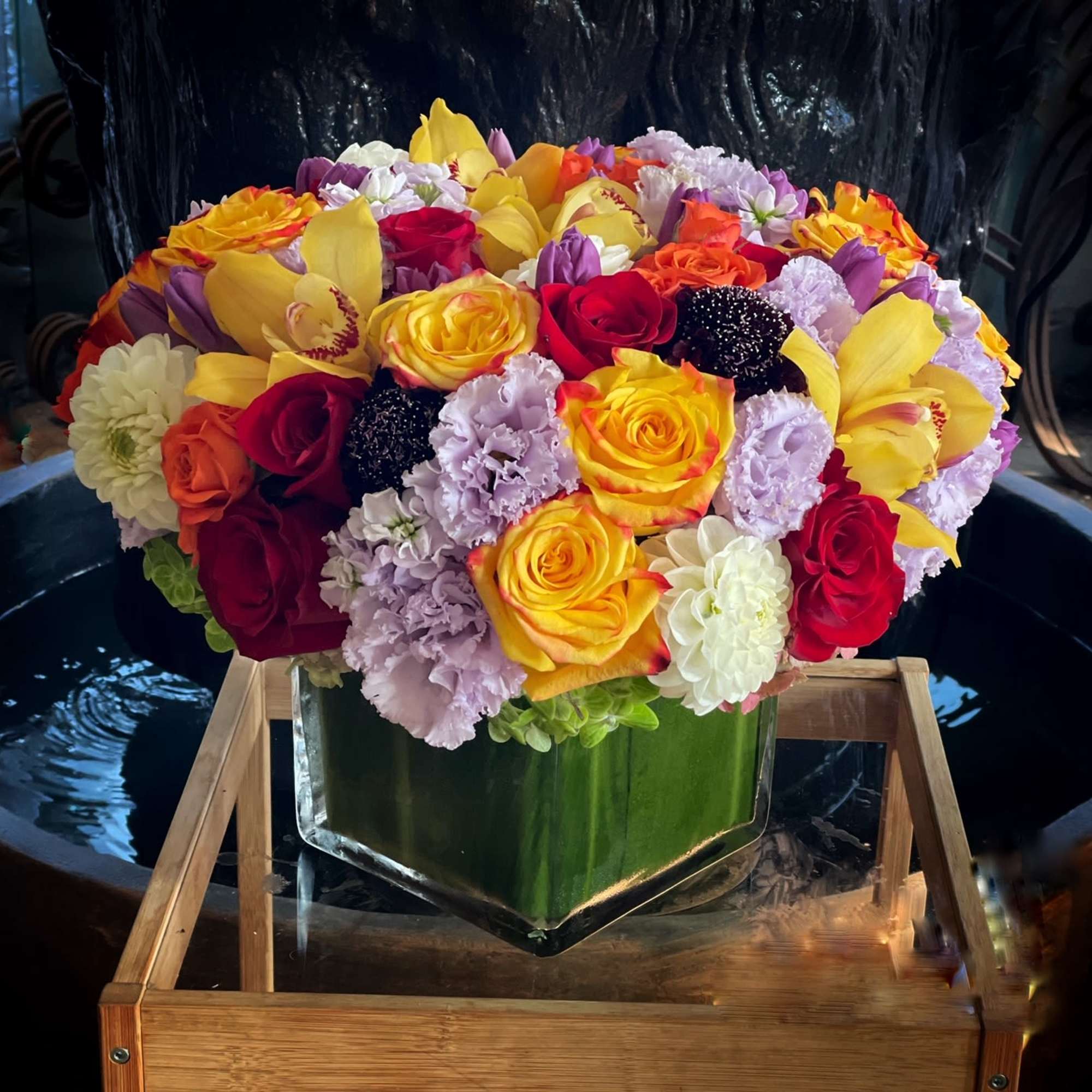 Hydrangea, Cymbidium Orchid, Protea, and greens 