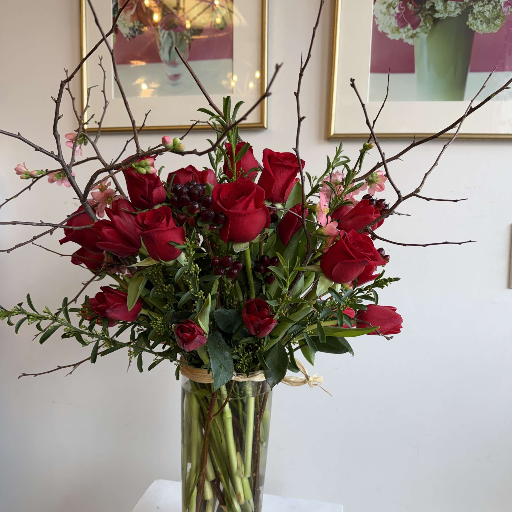beautiful red tulips 
red roses 
Pink quince flowering branched 
Hypericum burgundy 
