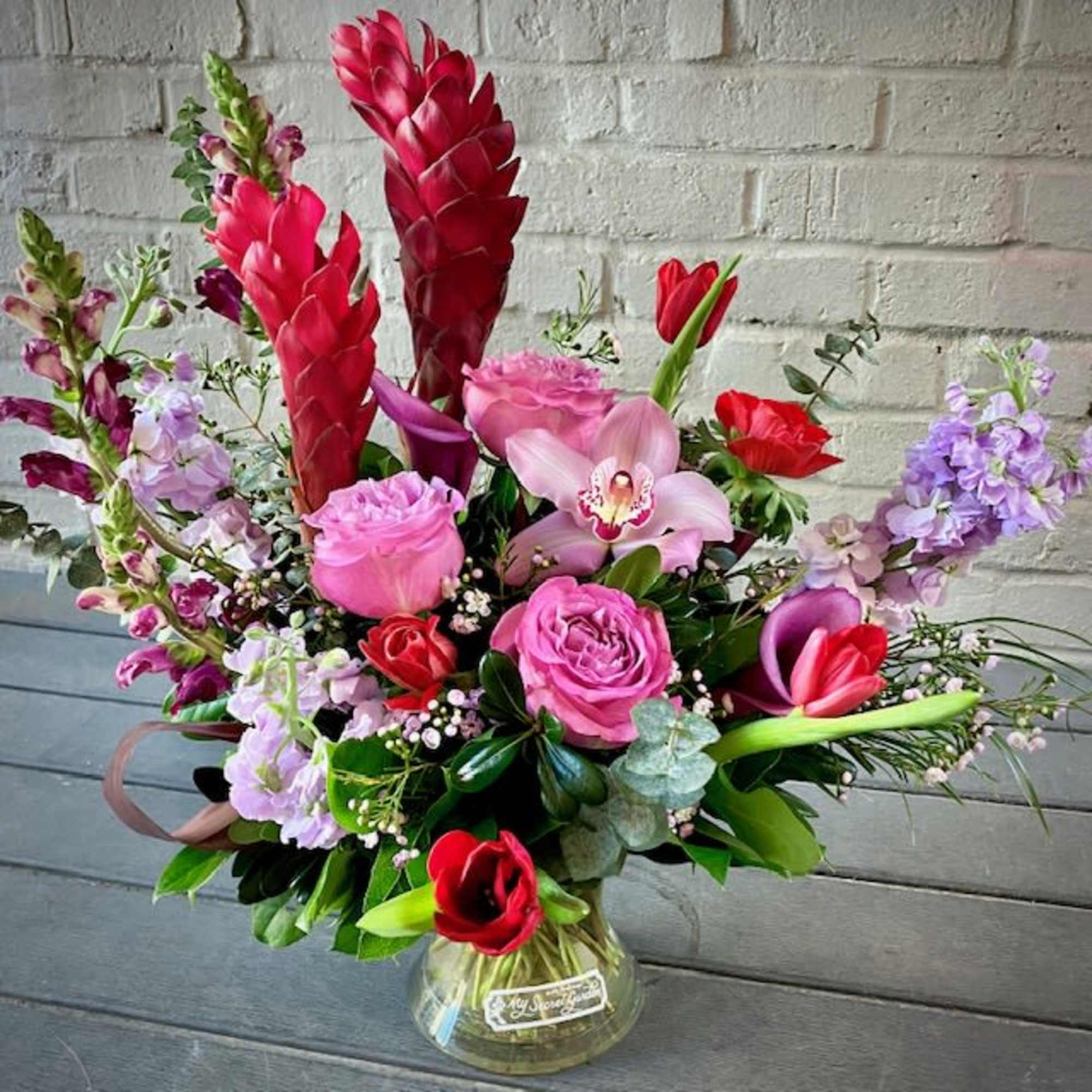 Enjoy the luminous opulence of the Luxurious Garden arrangement, the perfect gift