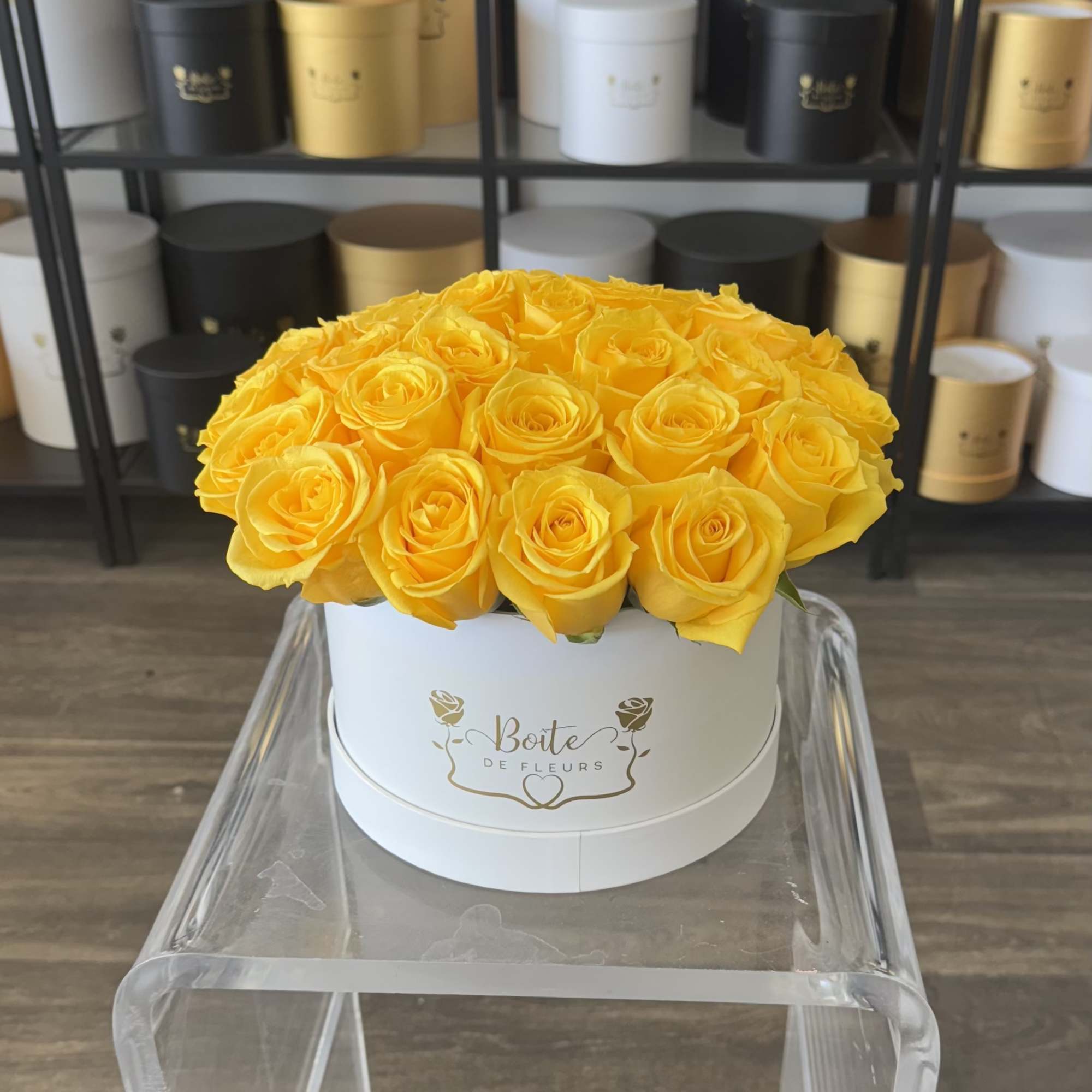 2-3 dozen fresh beautiful yellow roses nestled in a medium sized white