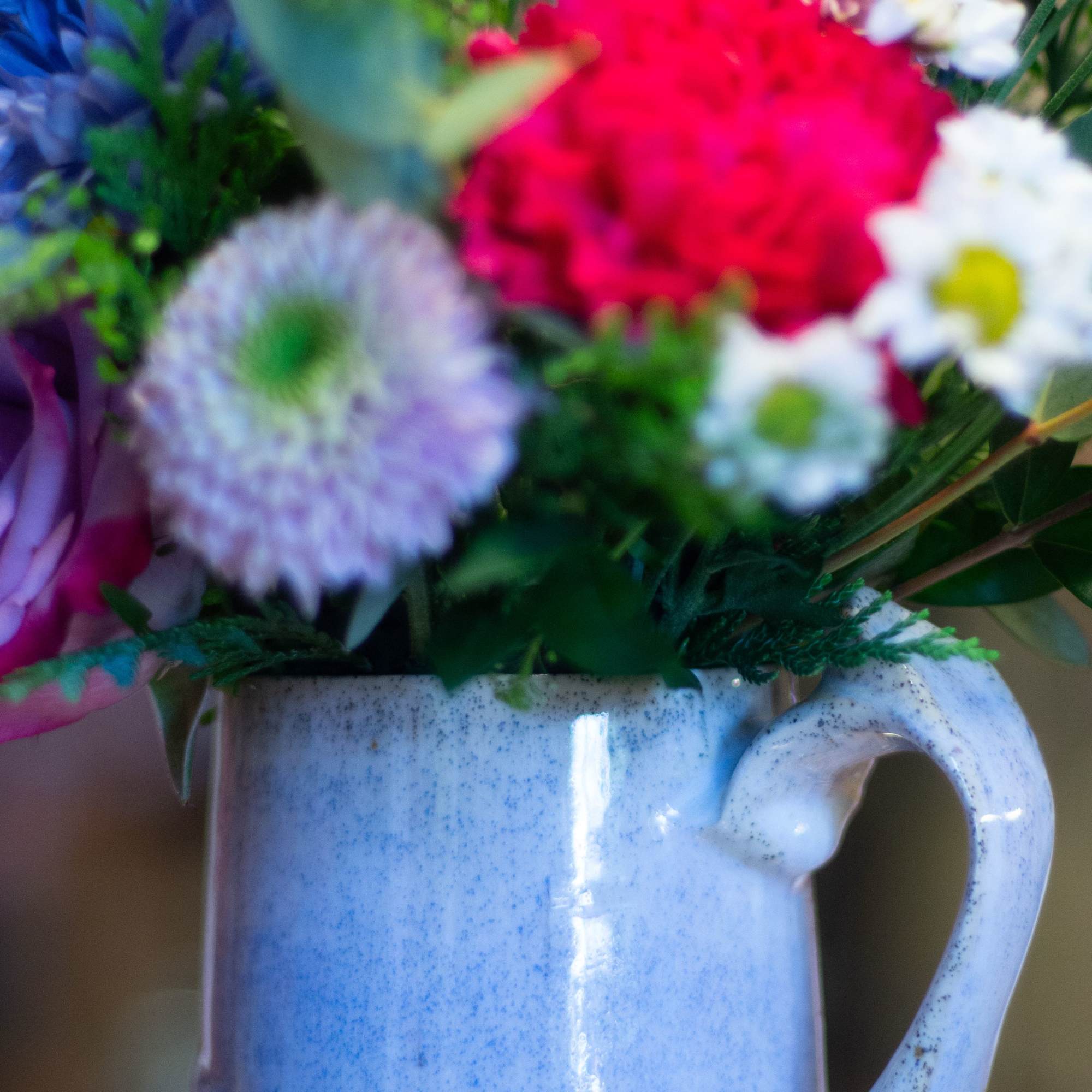 The flowers and dried accents are designer's choice, left in the hands
