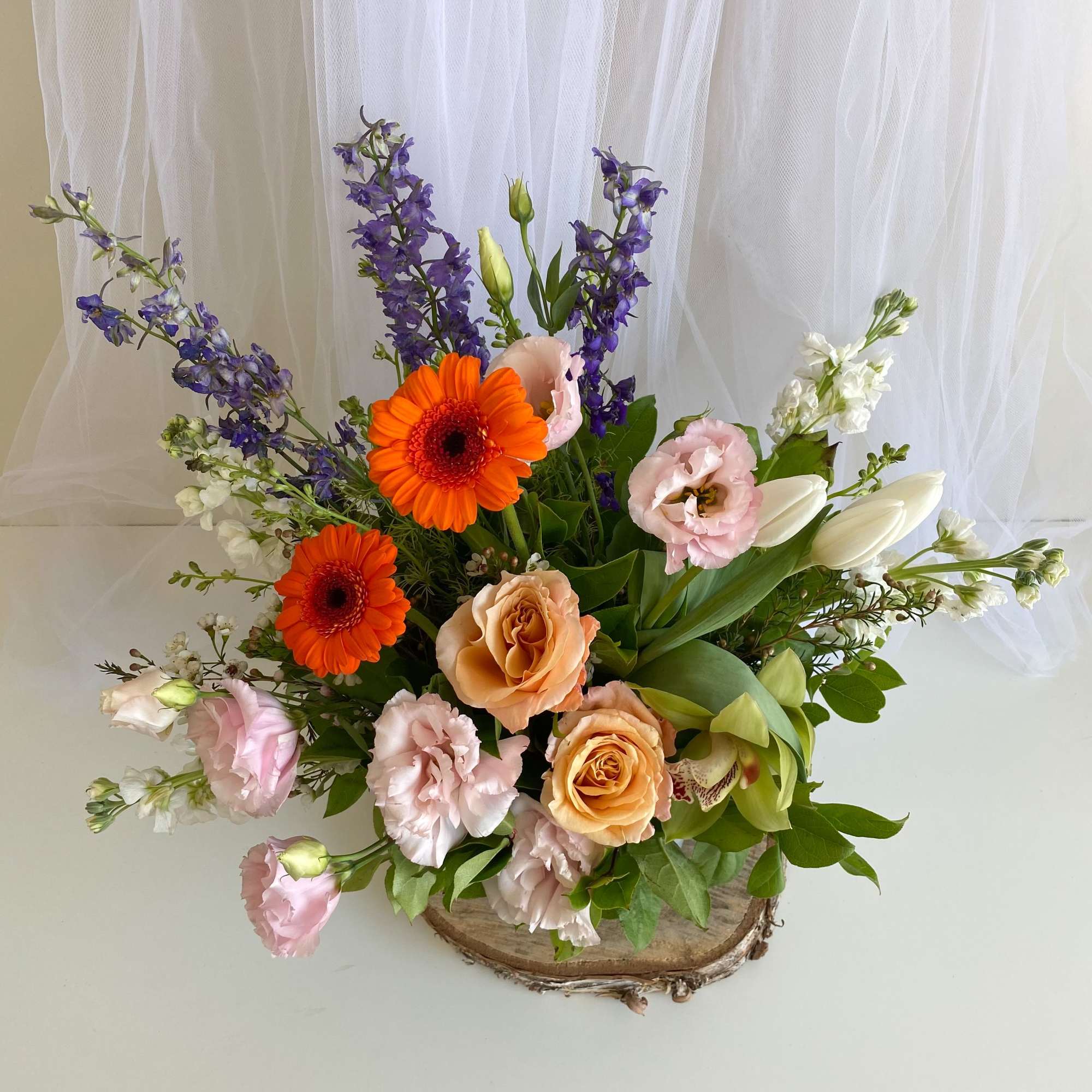 Theme Colors: Shades of pinks with a POP of color

Featured Blooms: Orchids