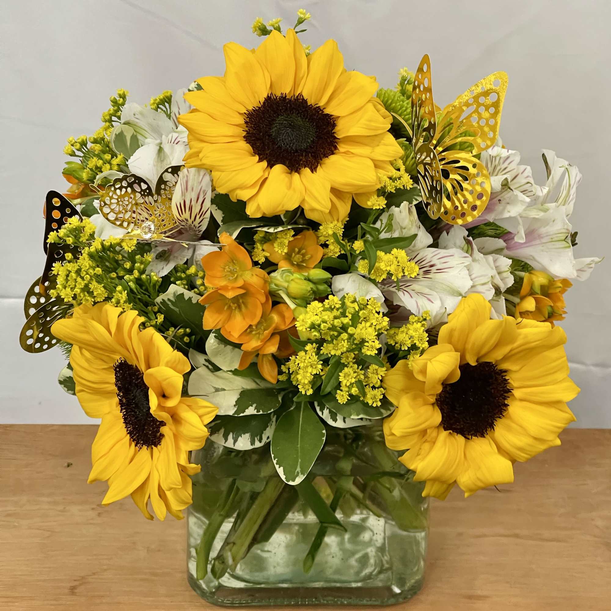 Bright Sunflower bouquets with white and yellow filler flowers