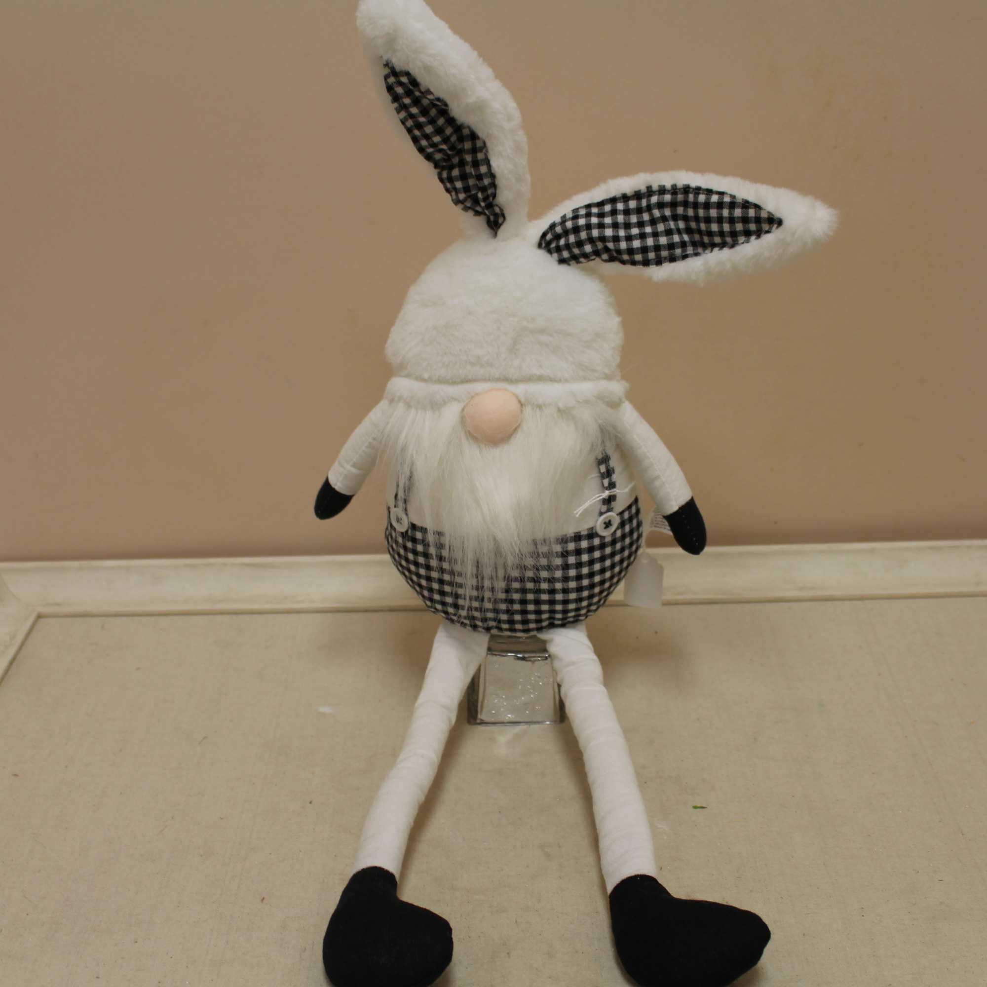 This fresh arrangement includes spring blooms, including the sweet black and white