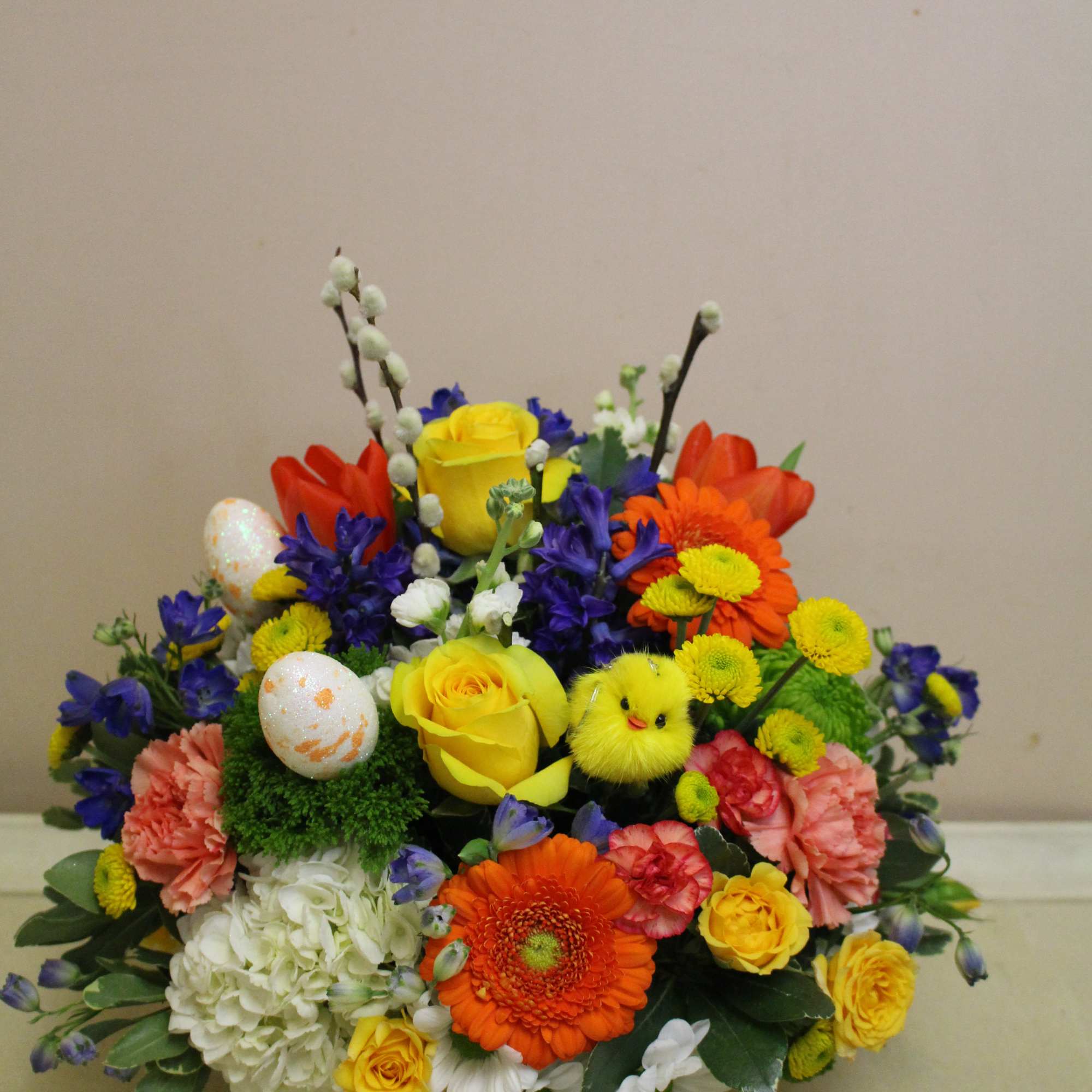 Here&rsquo;s a cheerful centerpiece brimming with lovely spring flowers, and look&mdash;a cute