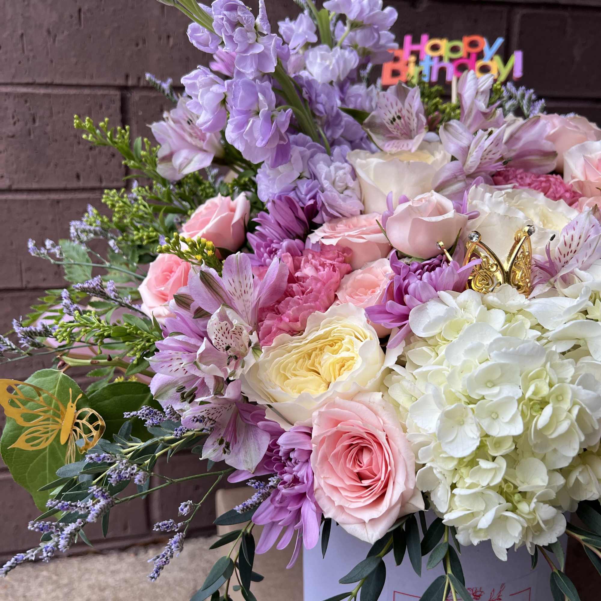 A dreamy pastel arrangement designed to make any birthday unforgettable. This lush