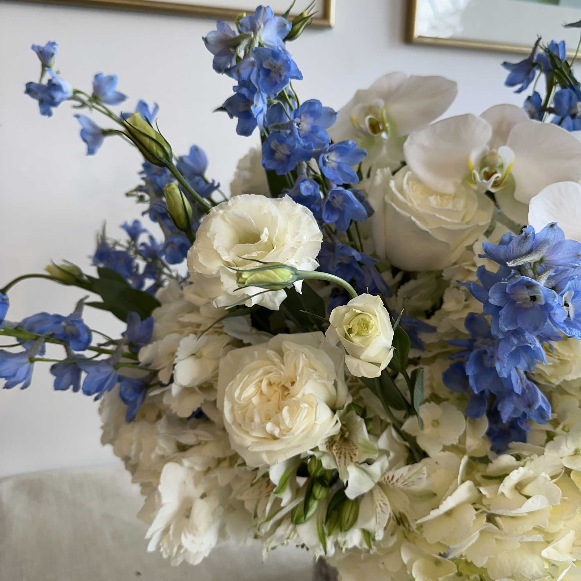 lisianthus with hydrangea, delphinium, white orchid, playa Blanca roses
