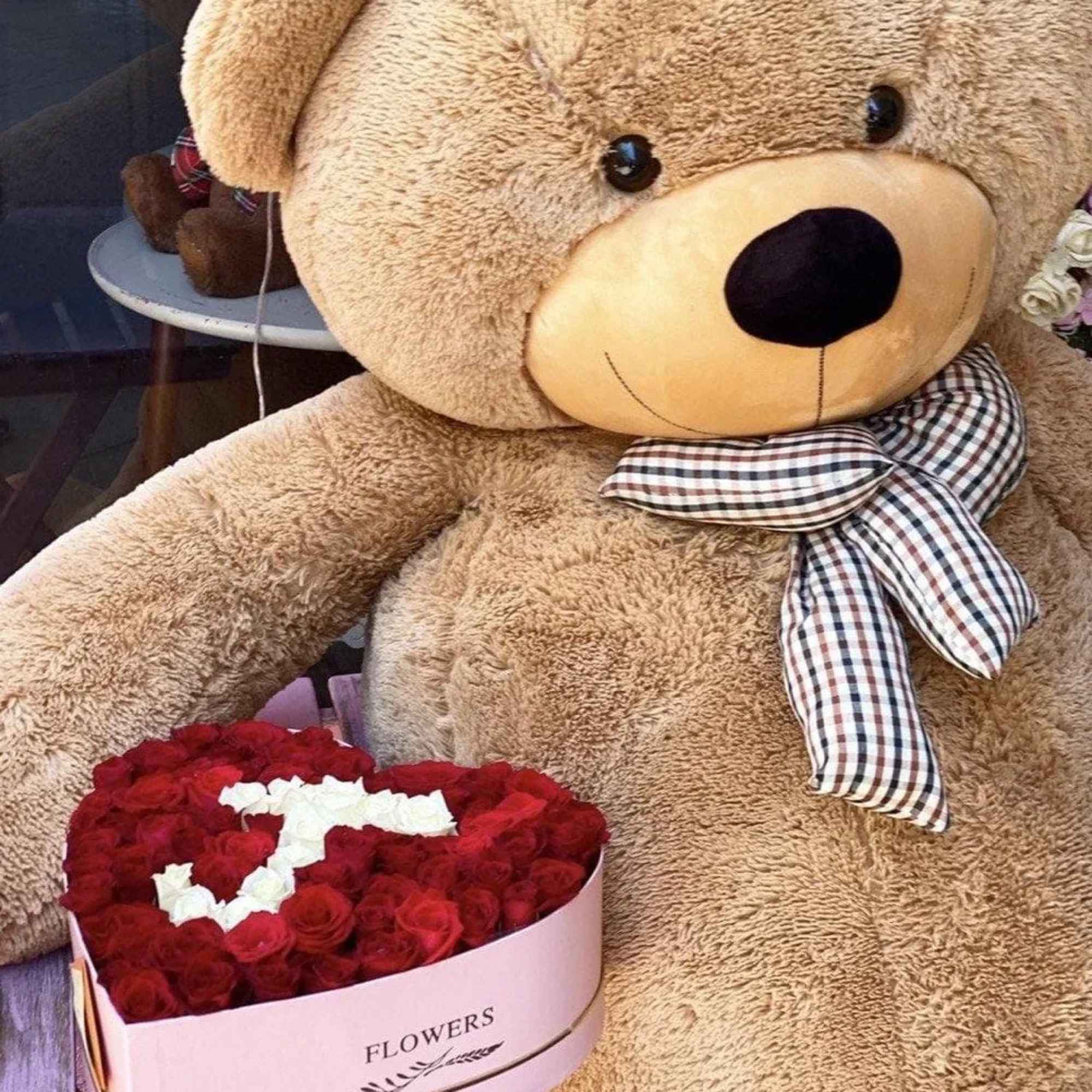 Beautiful heart box with your initials. We offer any color of roses