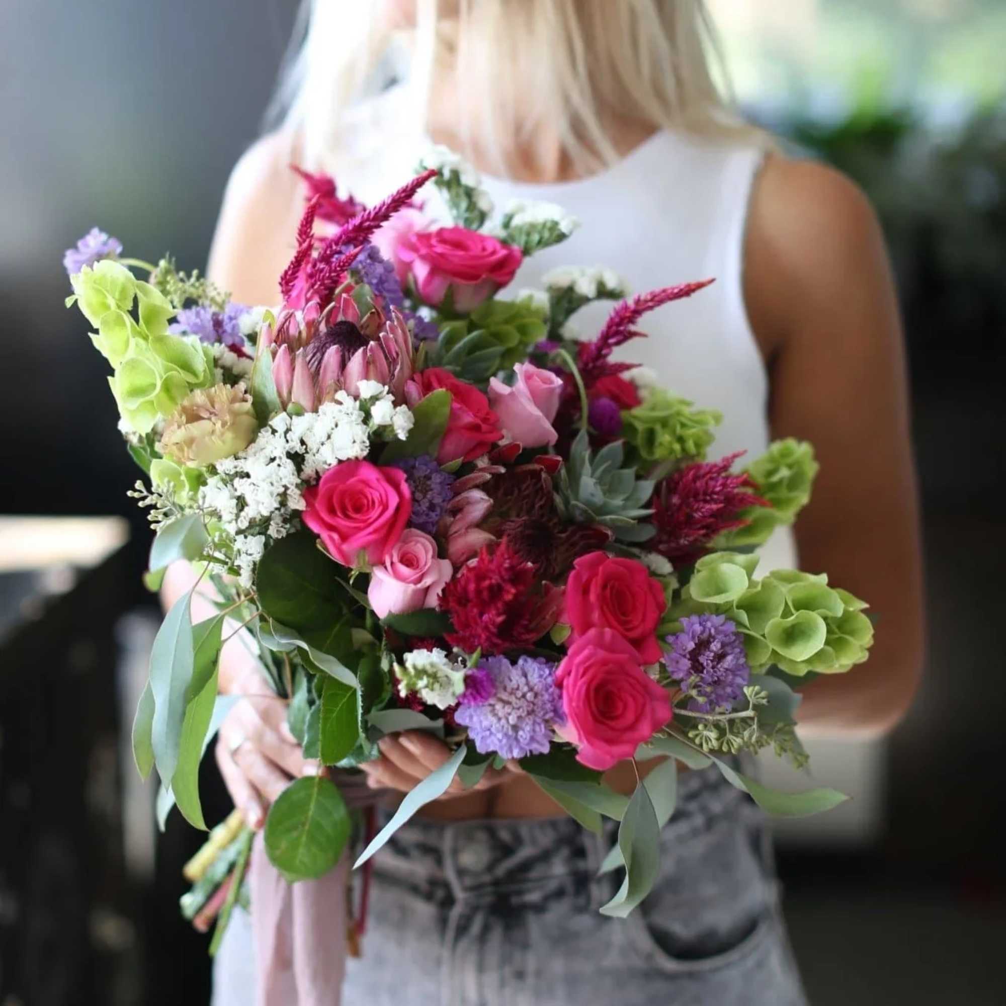 The best exotic bouquet's made of roses, proteas, succulents, eucalyptus, statice bloom