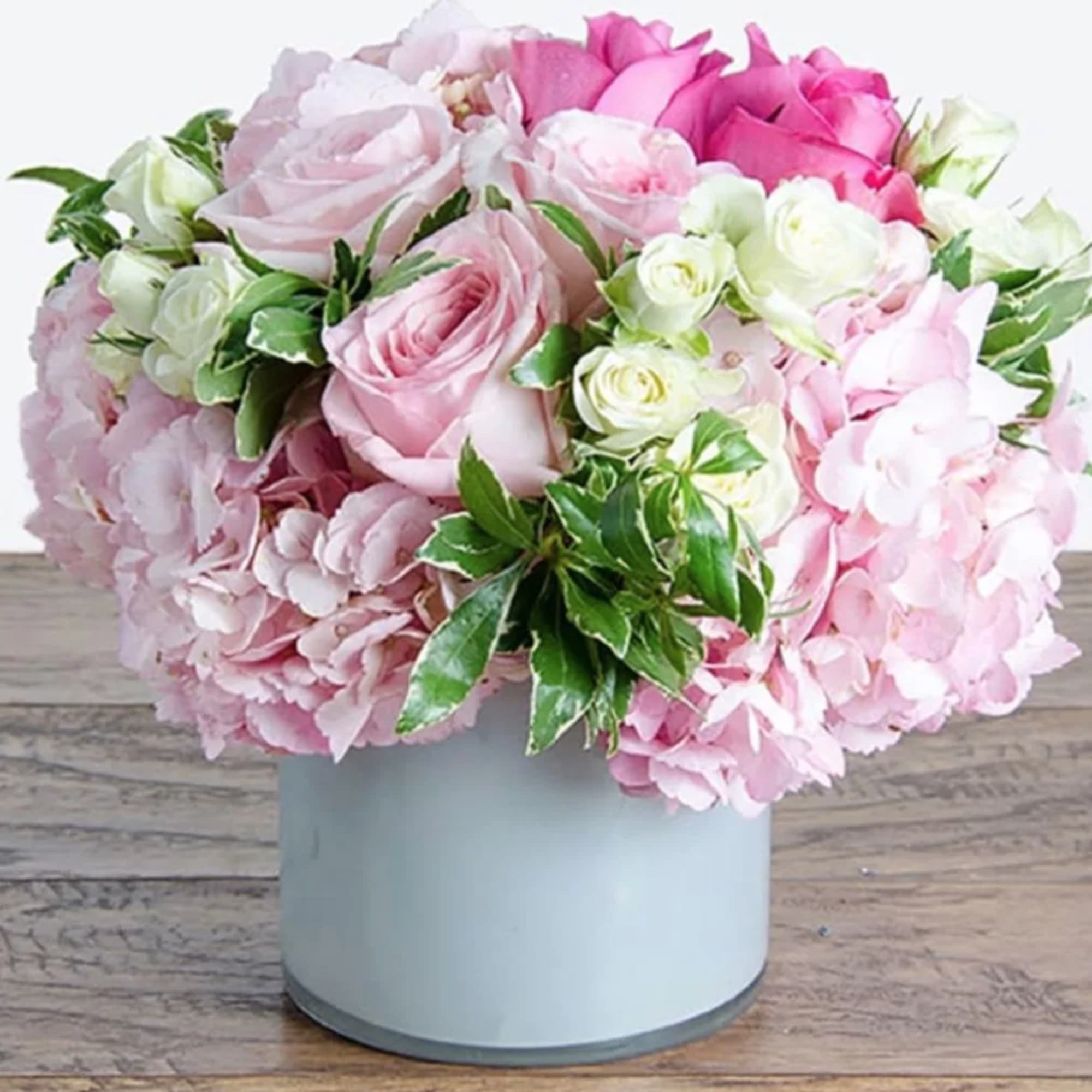 This stunning arrangement will put a smile on anyone! 
It's filled with