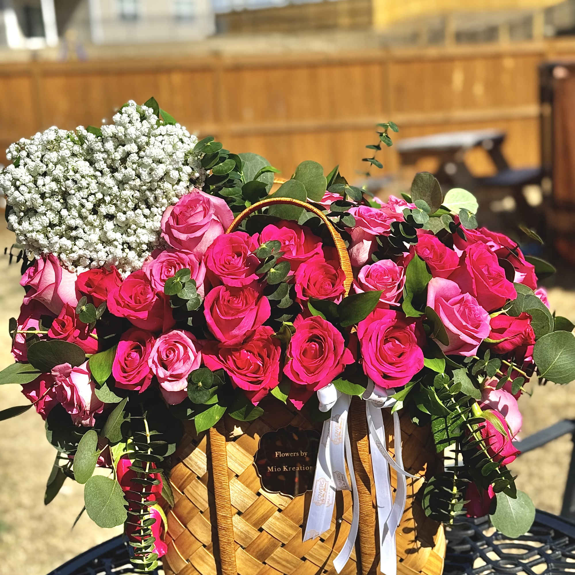 BEAUTIFUL BROWN BAG /BASKET FULL OF ROSES, UCALIPTUS AND GREENERY. PINK OR