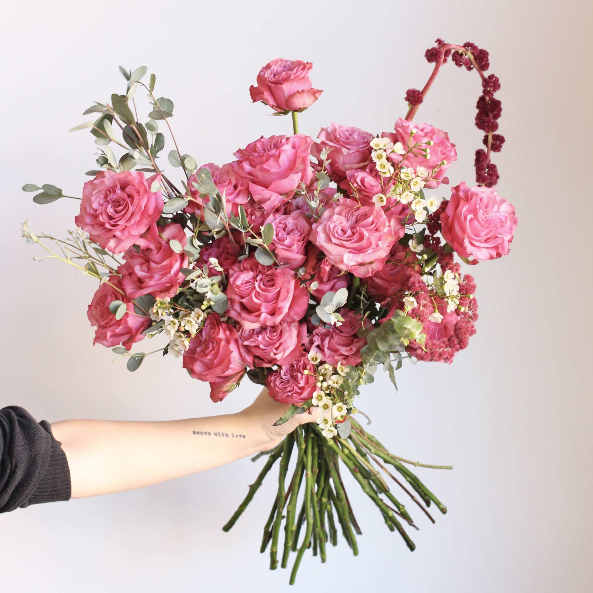 A classic expression of love, this two dozen rose arrangement features lush