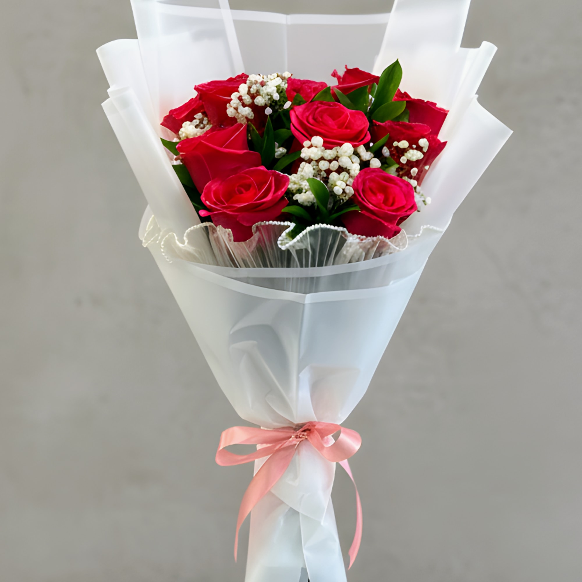 A timeless bouquet of HOT PINK roses accented with soft filler flowers