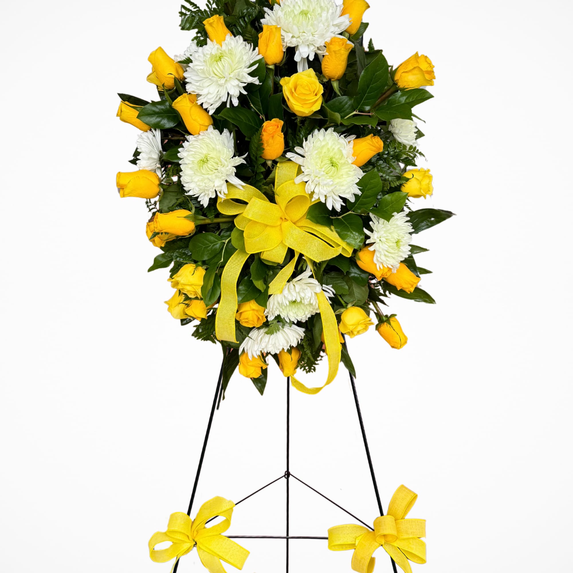 This standing spray is a graceful expression of love, remembrance, and hope.