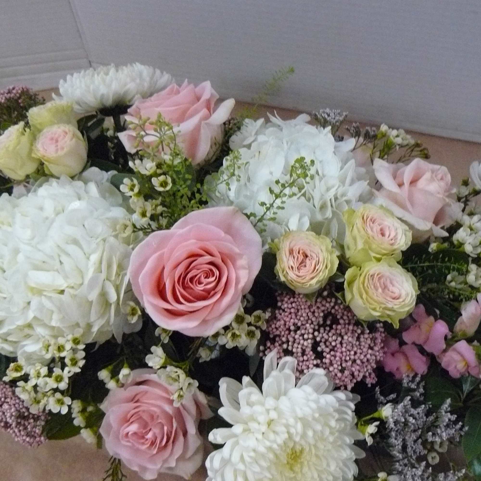 Roses, Hydrangea, Snapdragon, Cremons, Limonium, WaxFlower, Spray Roses, Rice Flower &amp;
Fancy Greens
cUSTOM