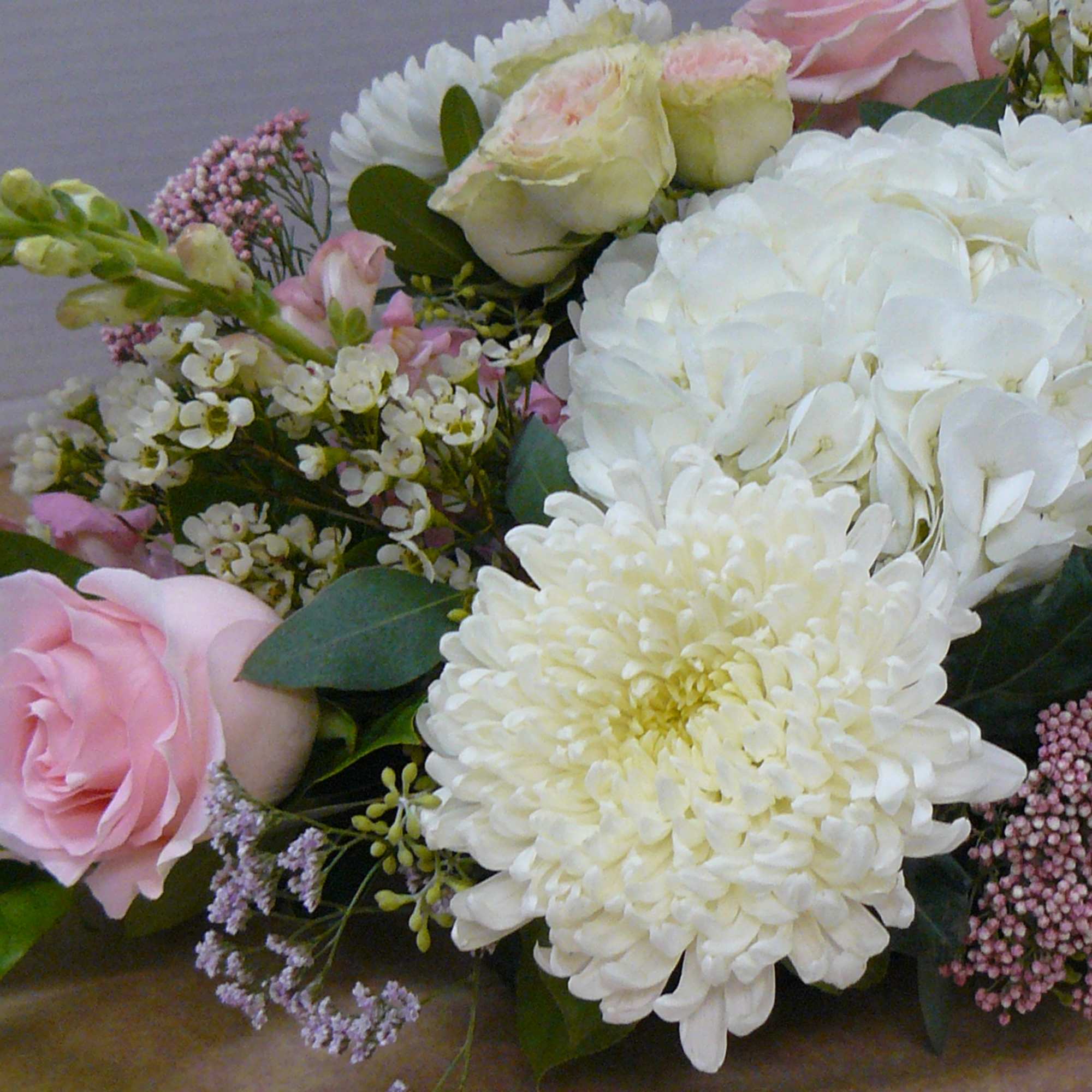 Roses, Hydrangea, Snapdragon, Cremons, Limonium, WaxFlower, Spray Roses, Rice Flower &amp;
Fancy Greens
cUSTOM