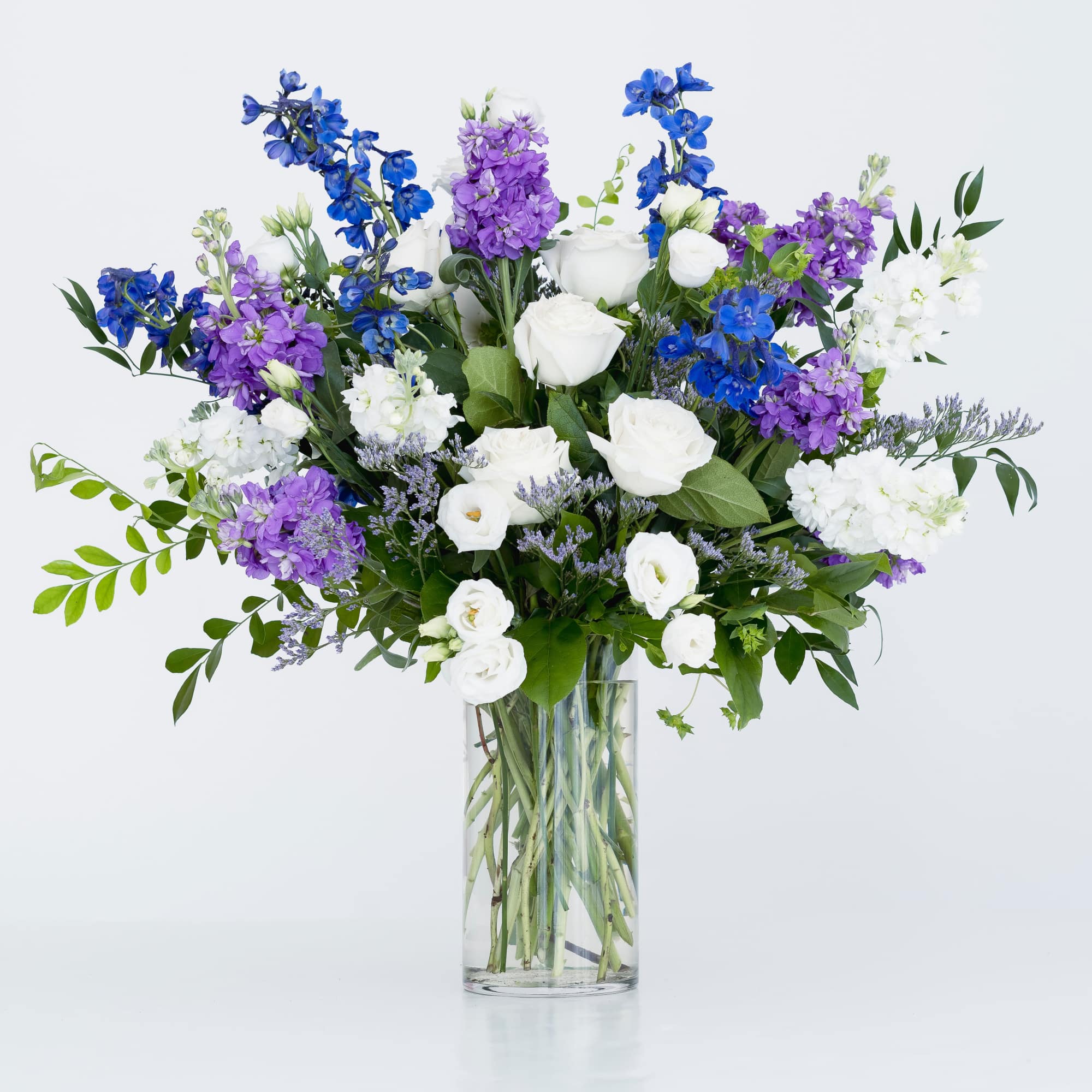 A gorgeous and dramatic arrangement in shades of blue, purple and white