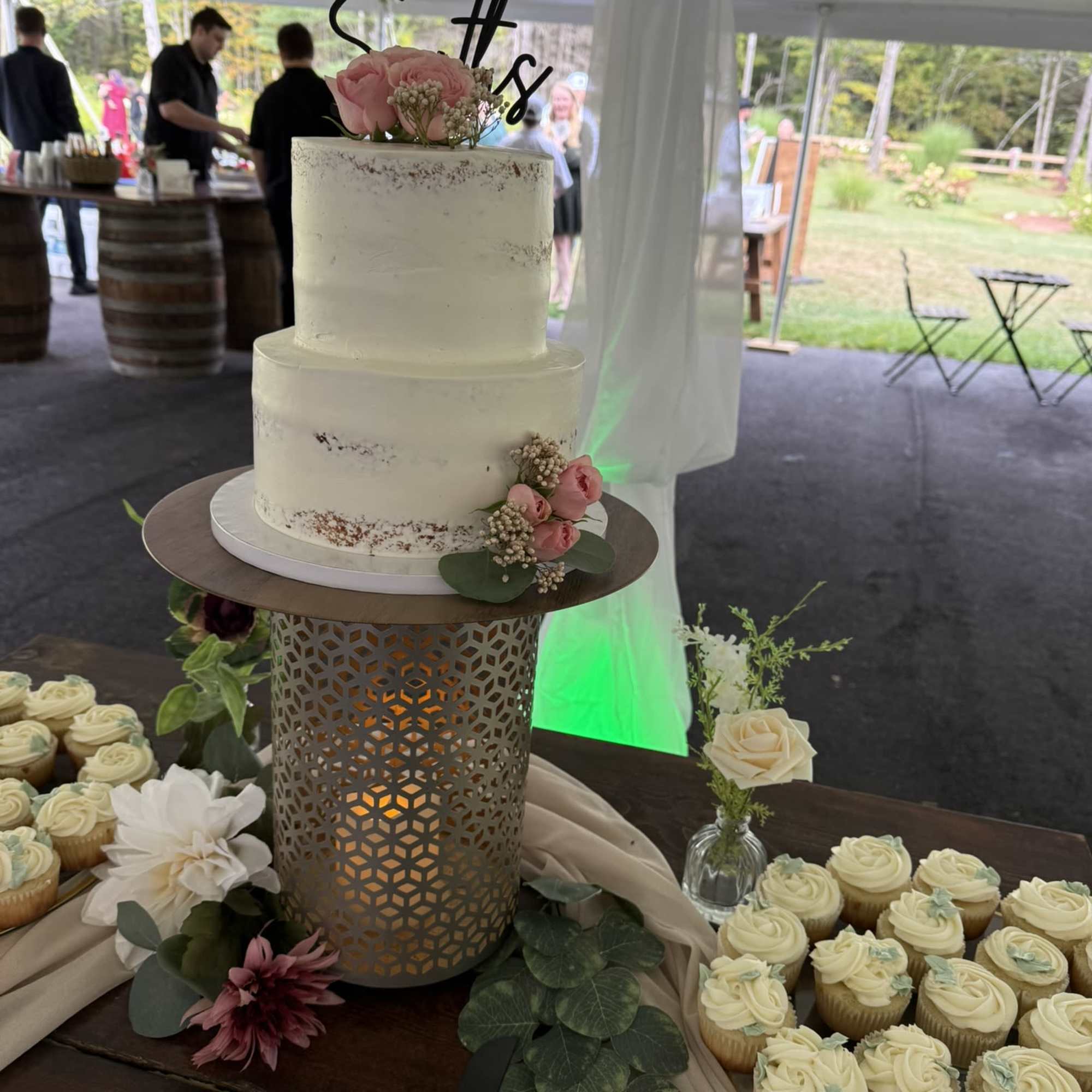 A beautifully styled cake decoration featuring delicate florals and refined details, designed