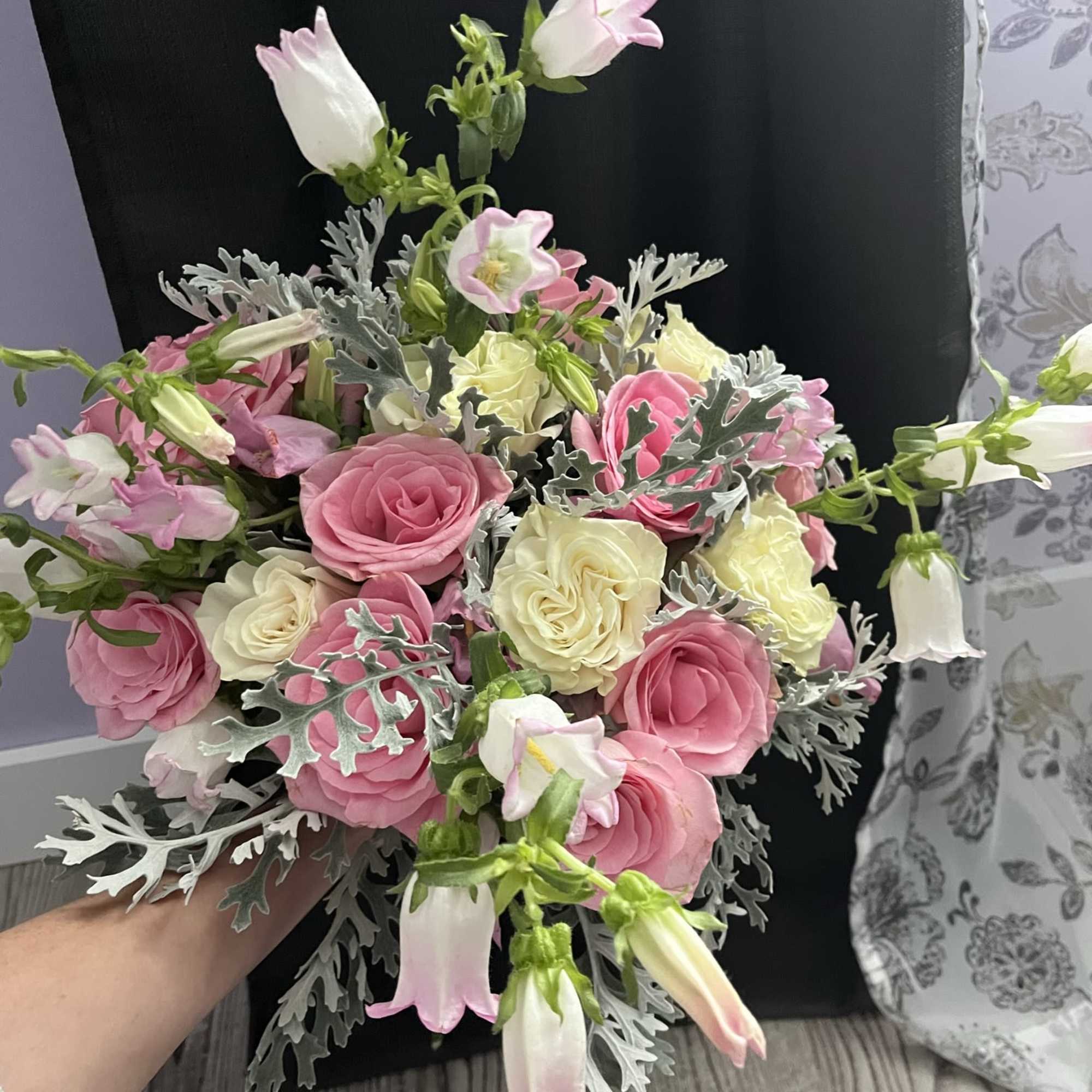 A lush garden-style bridal bouquet featuring delicate blush pink blooms blended with