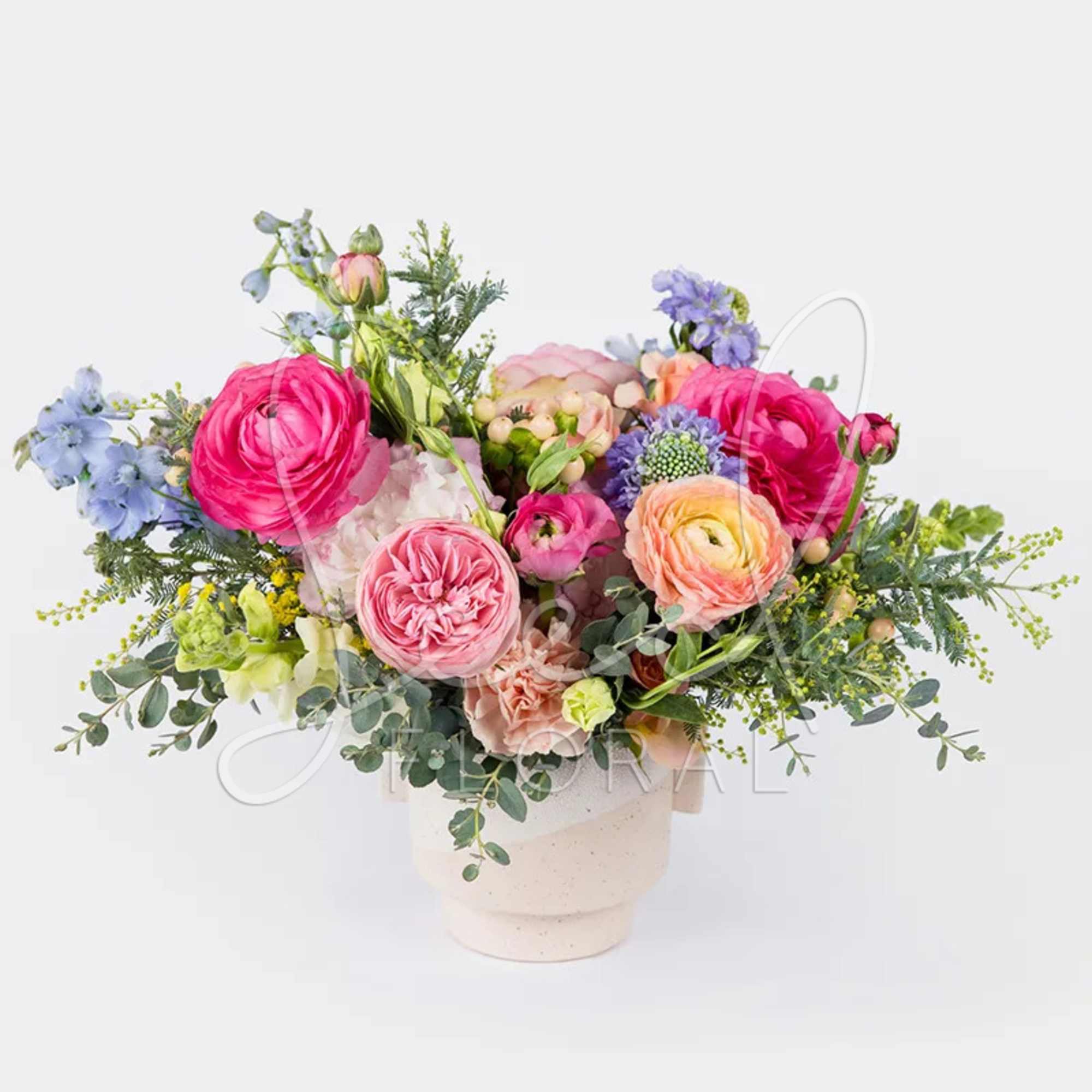 Oh so pretty! Dreamy pastel premium seasonal florals arranged in modern footed