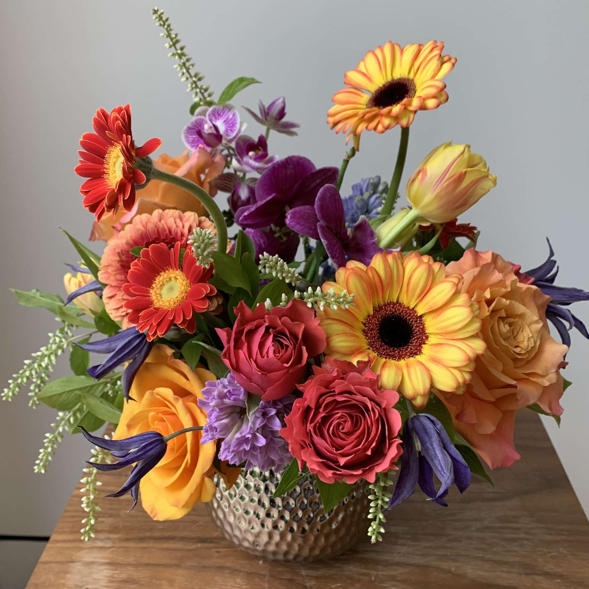 Cute colorful flower arrangement of premium flowers in a silver Supernova Pot