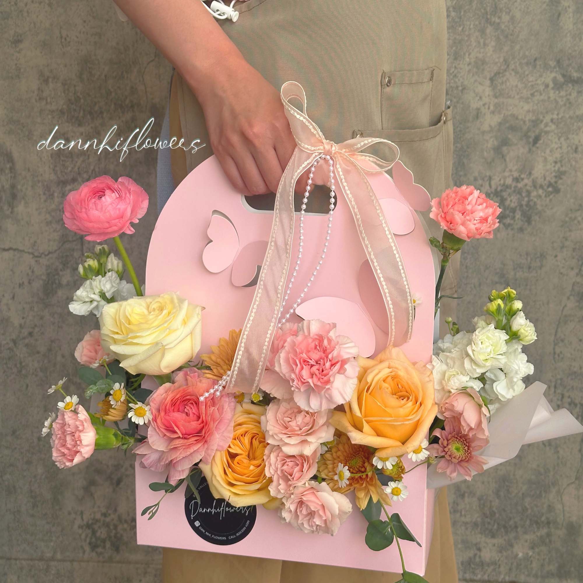 Delicate blooms in soft pastel tones, nestled in a charming butterfly pink