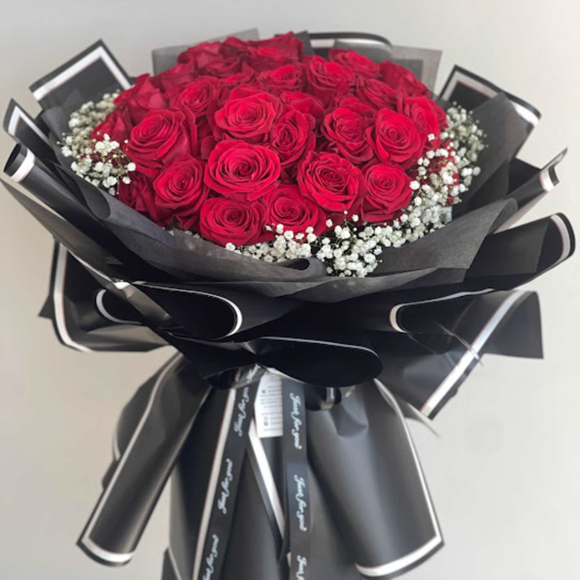 The Photo is Standard 12 premium long stem roses. Deluxe is 2
