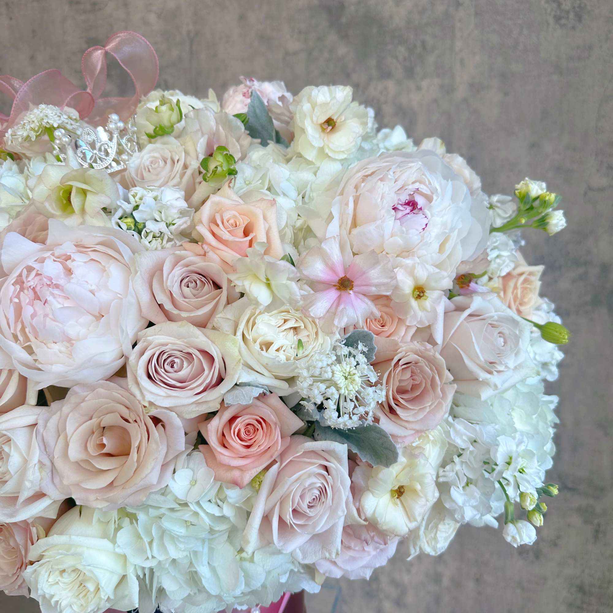 A statement of quiet luxury, a lush, sophisticated arrangement featuring soft, muted