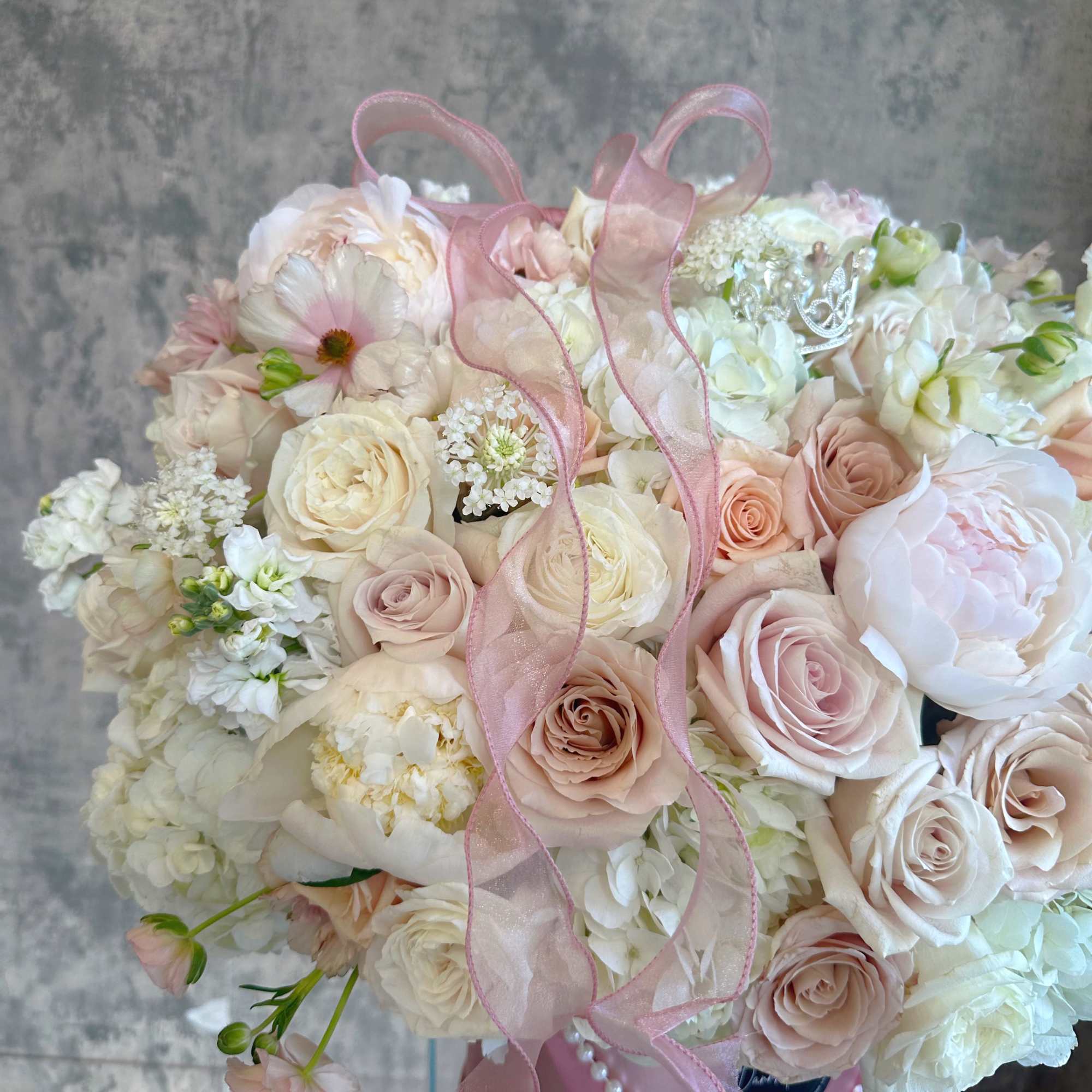 A statement of quiet luxury, a lush, sophisticated arrangement featuring soft, muted