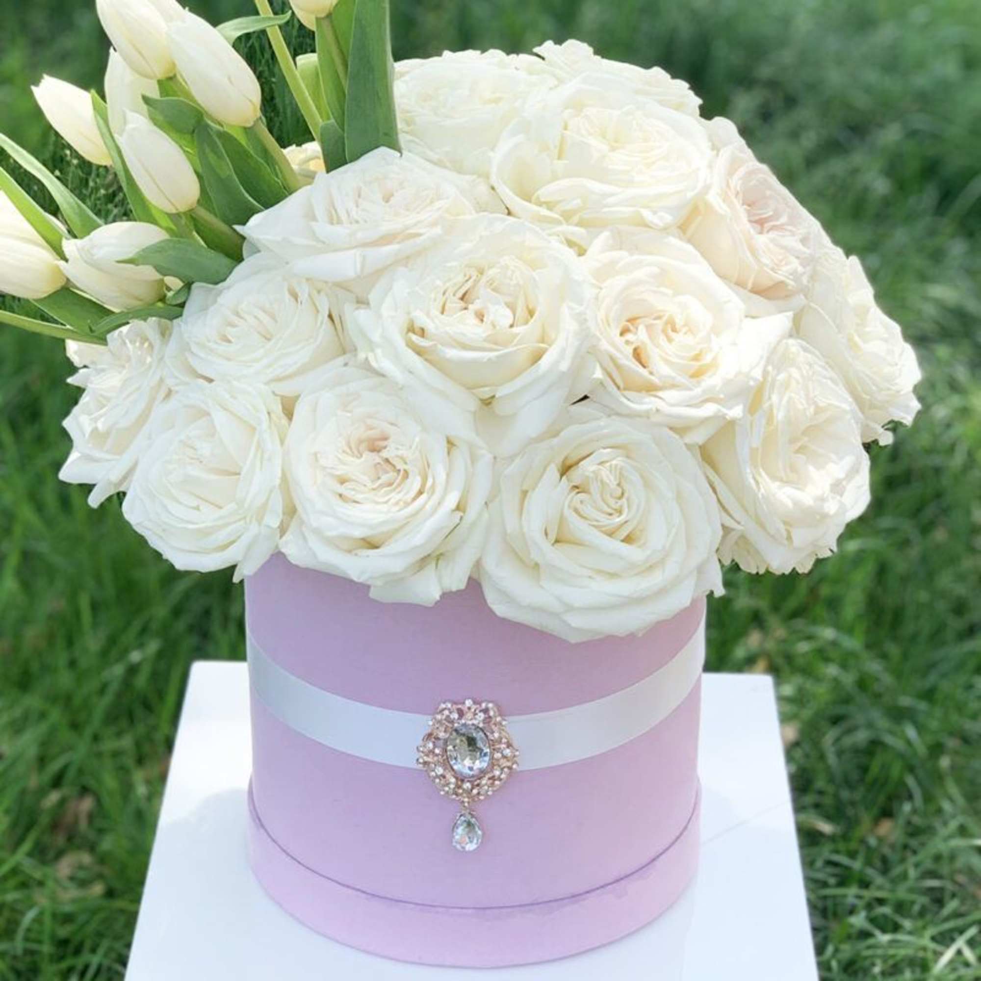 All white premium garden roses with an eruption of tulips in our