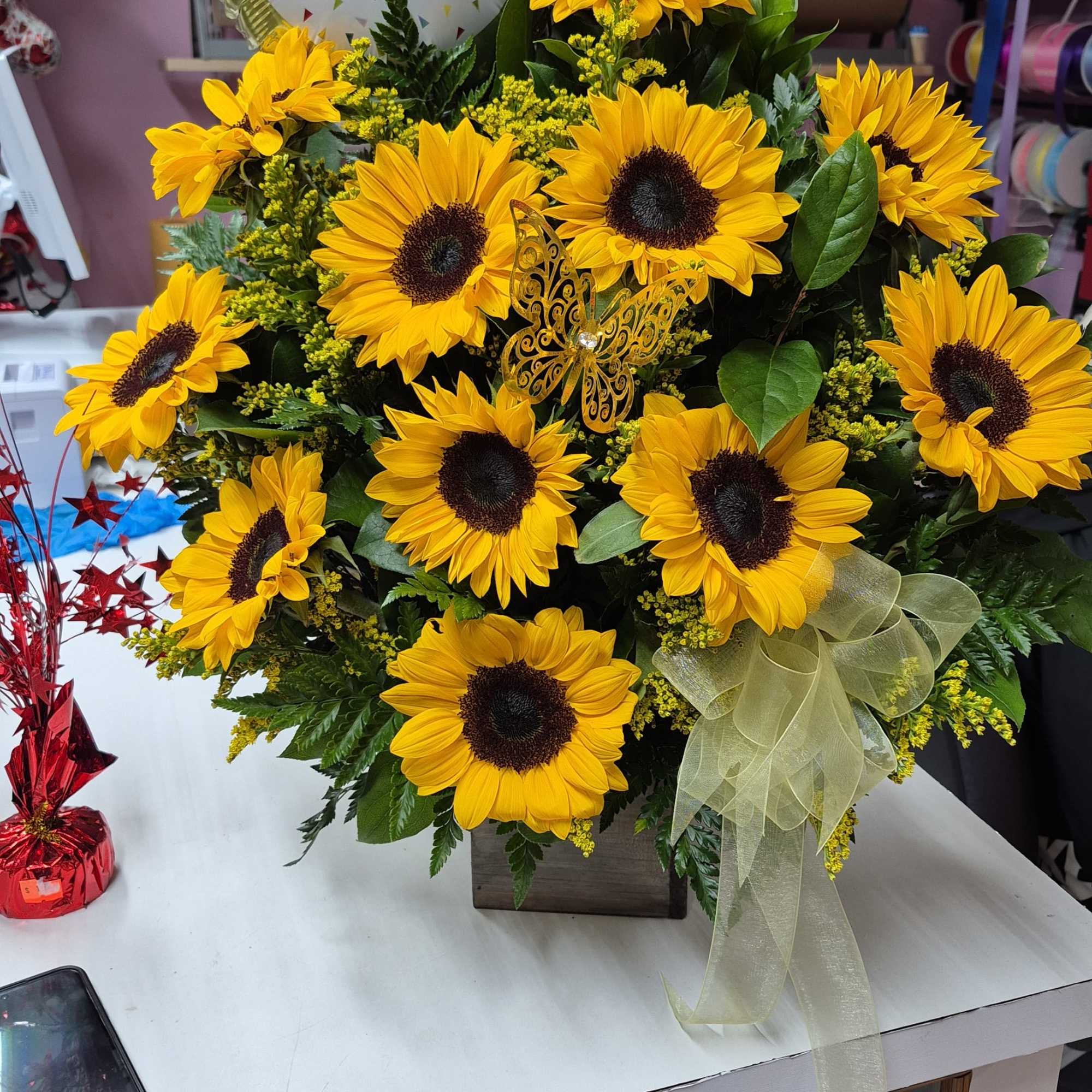 Sunflower arrangement in a sunflower-shaped base
