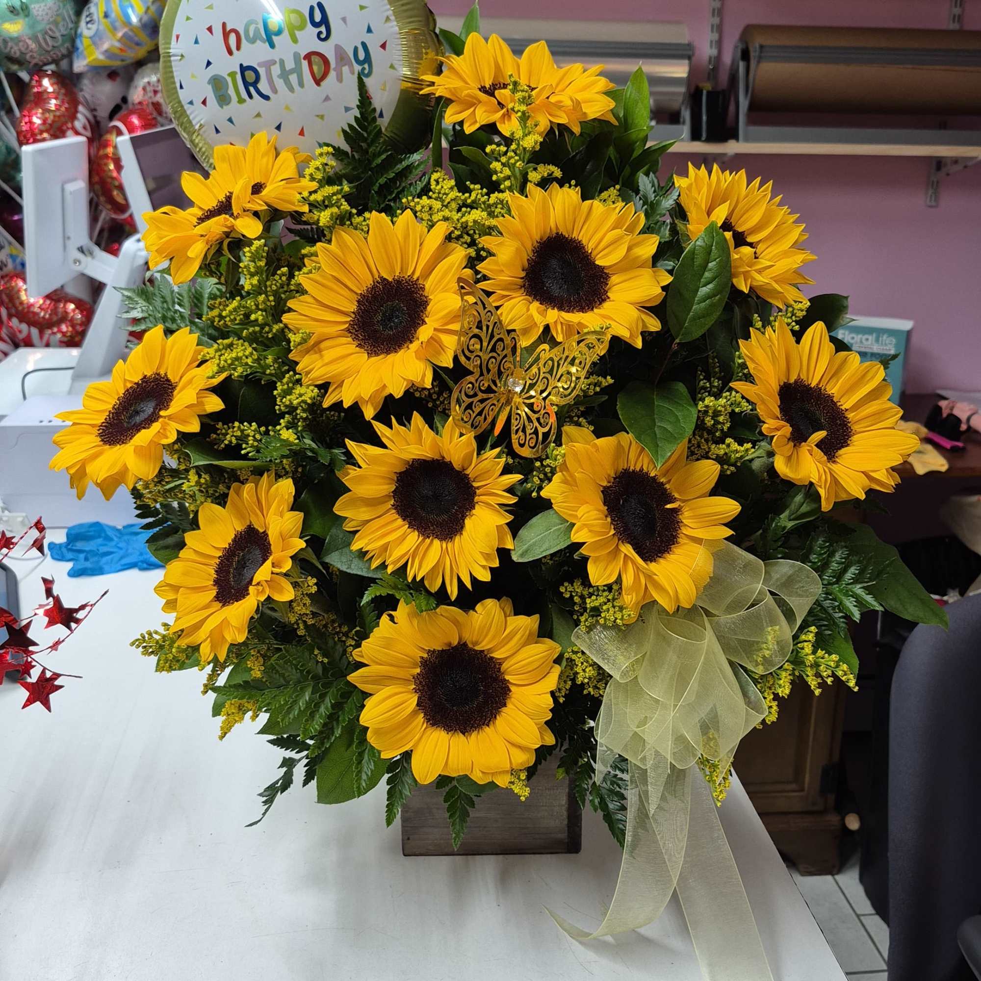 Sunflower arrangement in a sunflower-shaped base