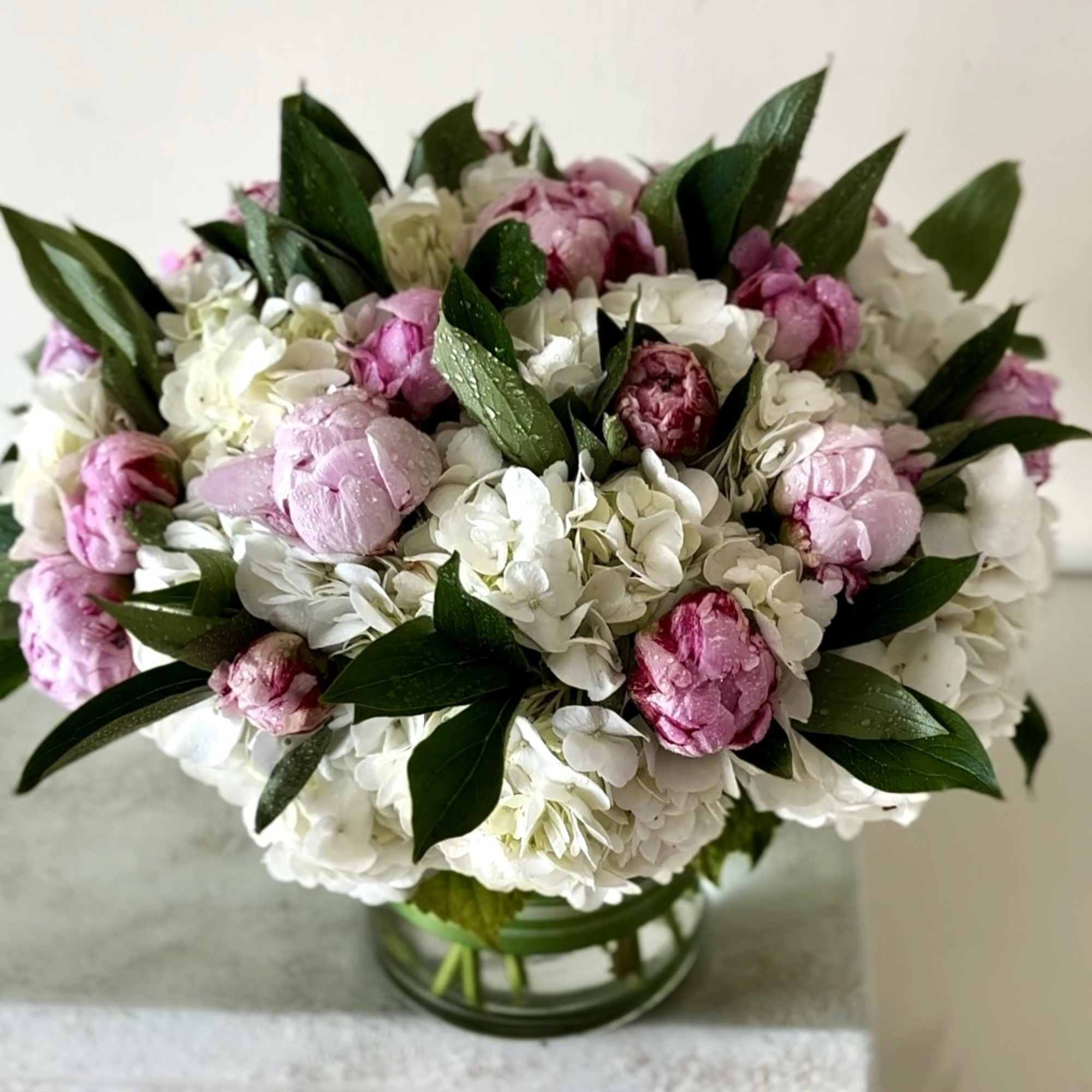 Pink Peonies and White Hydrangeas arranged in a vase