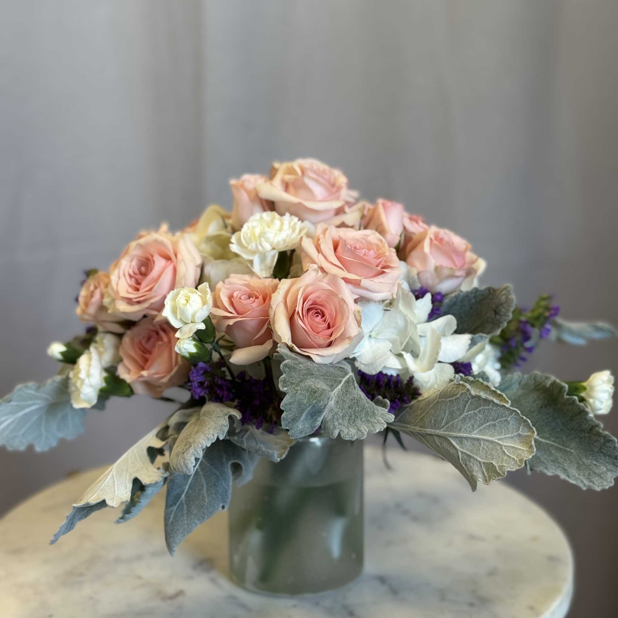 A soft and romantic floral design featuring premium blush roses beautifully paired