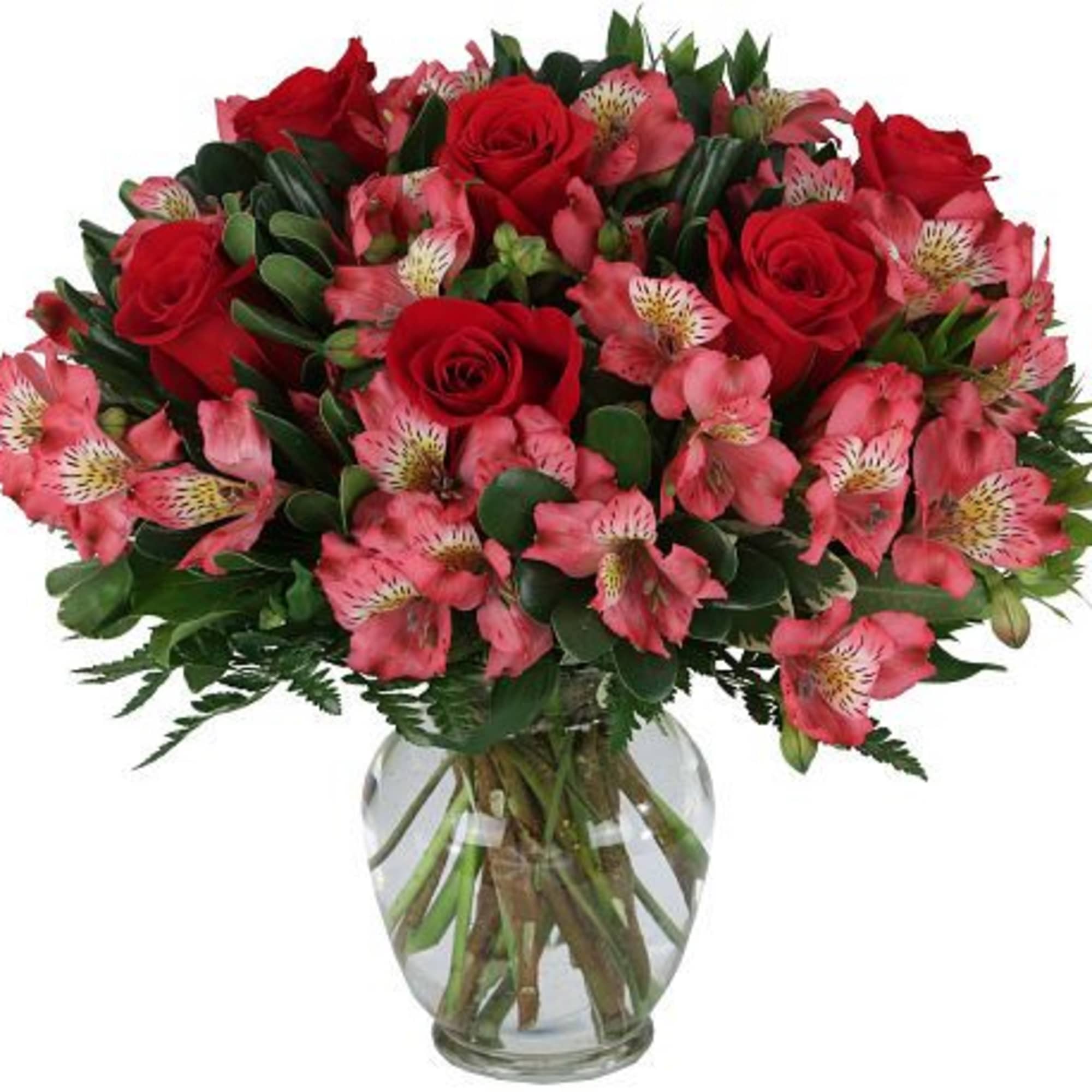 Classic red roses paired with soft pink alstroemeria in a clear glass