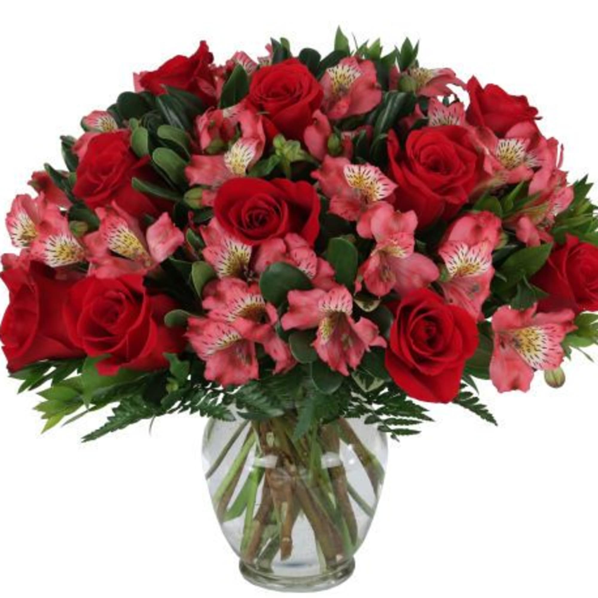 Classic red roses paired with soft pink alstroemeria in a clear glass